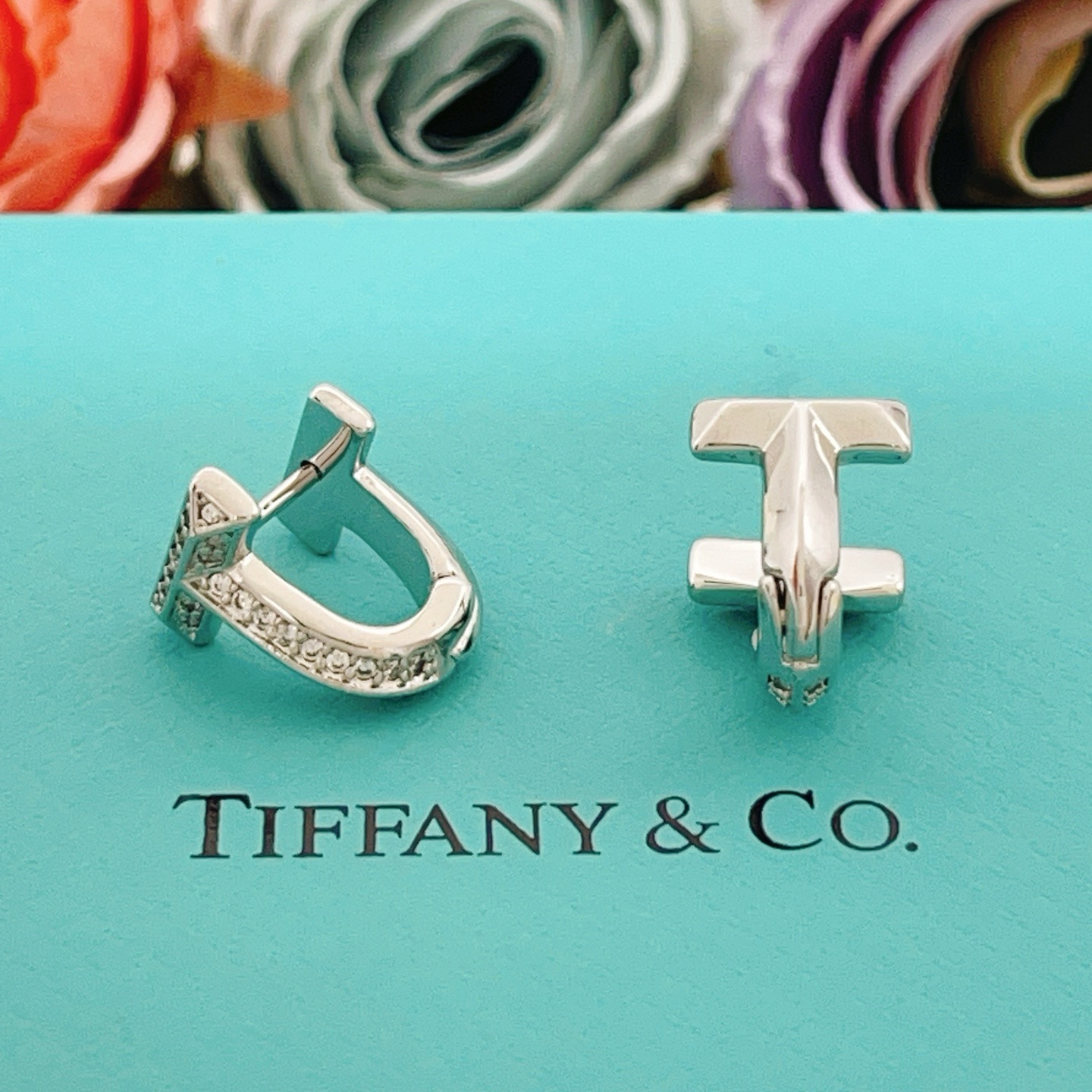 Tiffany Co Tiffany T earrings silver-toned metal with clear diamond accents 10mm