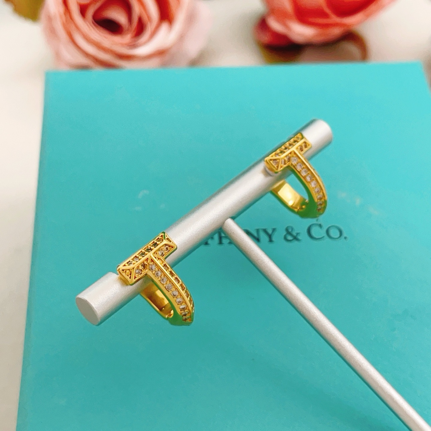 Tiffany Co Tiffany T earrings yellow gold with clear diamond accents 10mm hoop diameter
