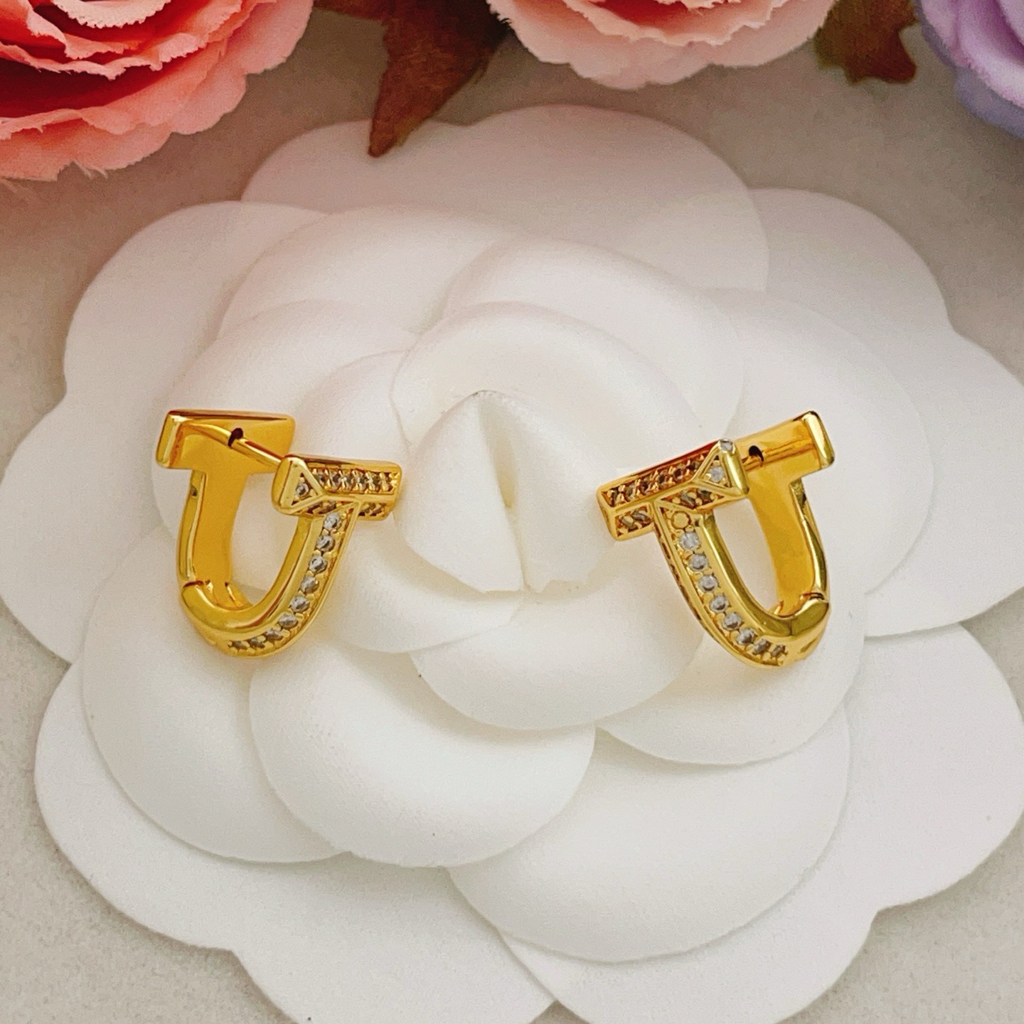 Tiffany Co Tiffany T earrings yellow gold with clear diamond accents 10mm hoop diameter