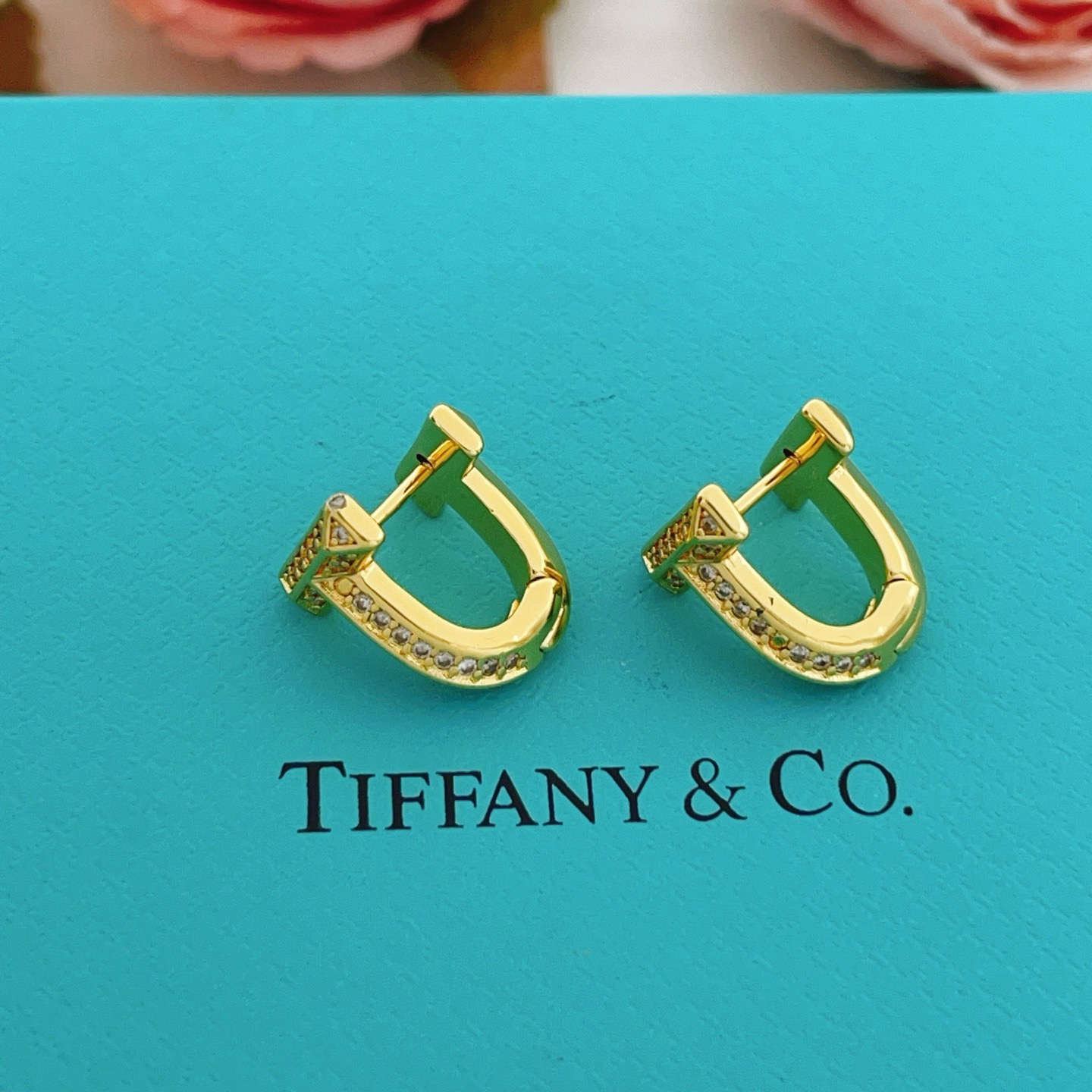 Tiffany Co Tiffany T earrings yellow gold with clear diamond accents 10mm hoop diameter