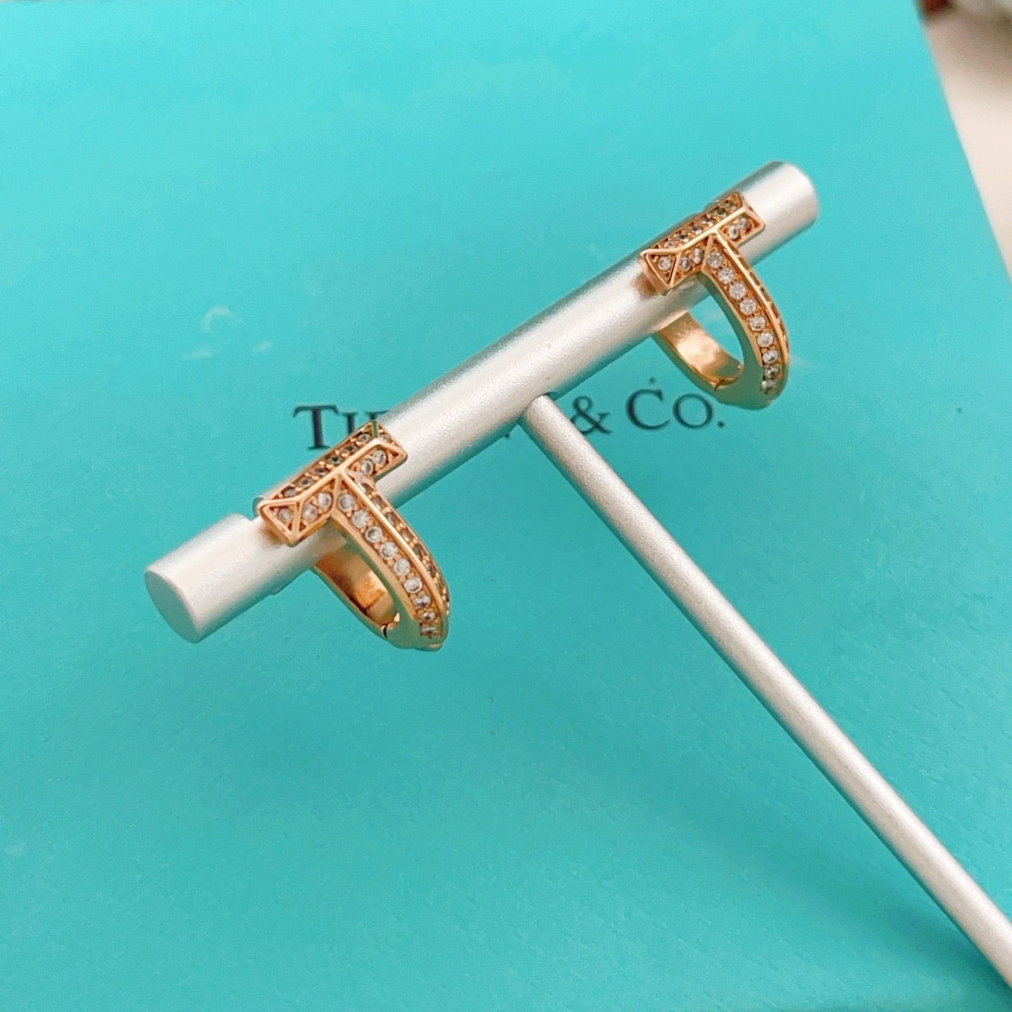 Tiffany Co Tiffany T earrings 18k rose gold with pave set clear diamonds 12mm hoop diameter
