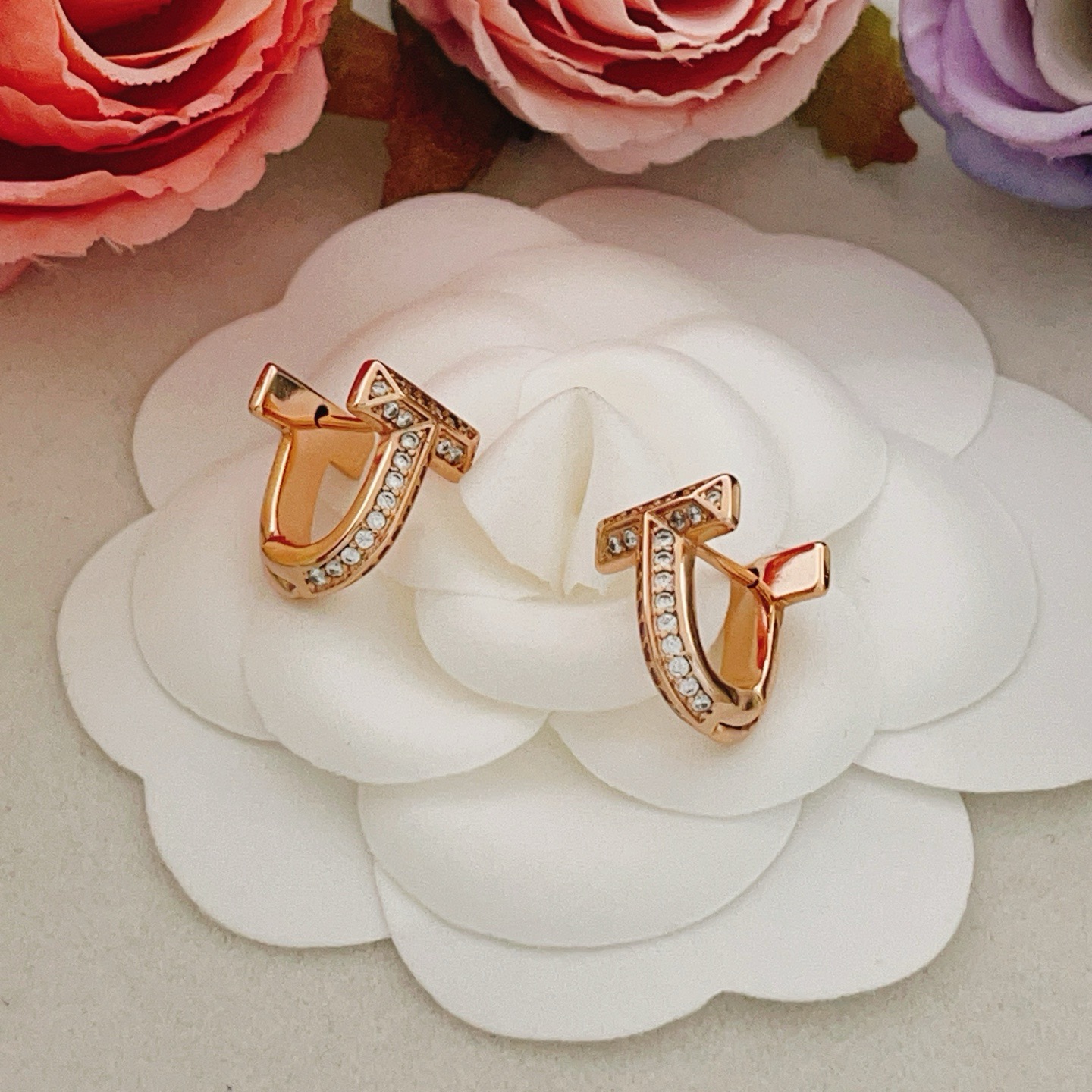 Tiffany Co Tiffany T earrings 18k rose gold with pave set clear diamonds 12mm hoop diameter