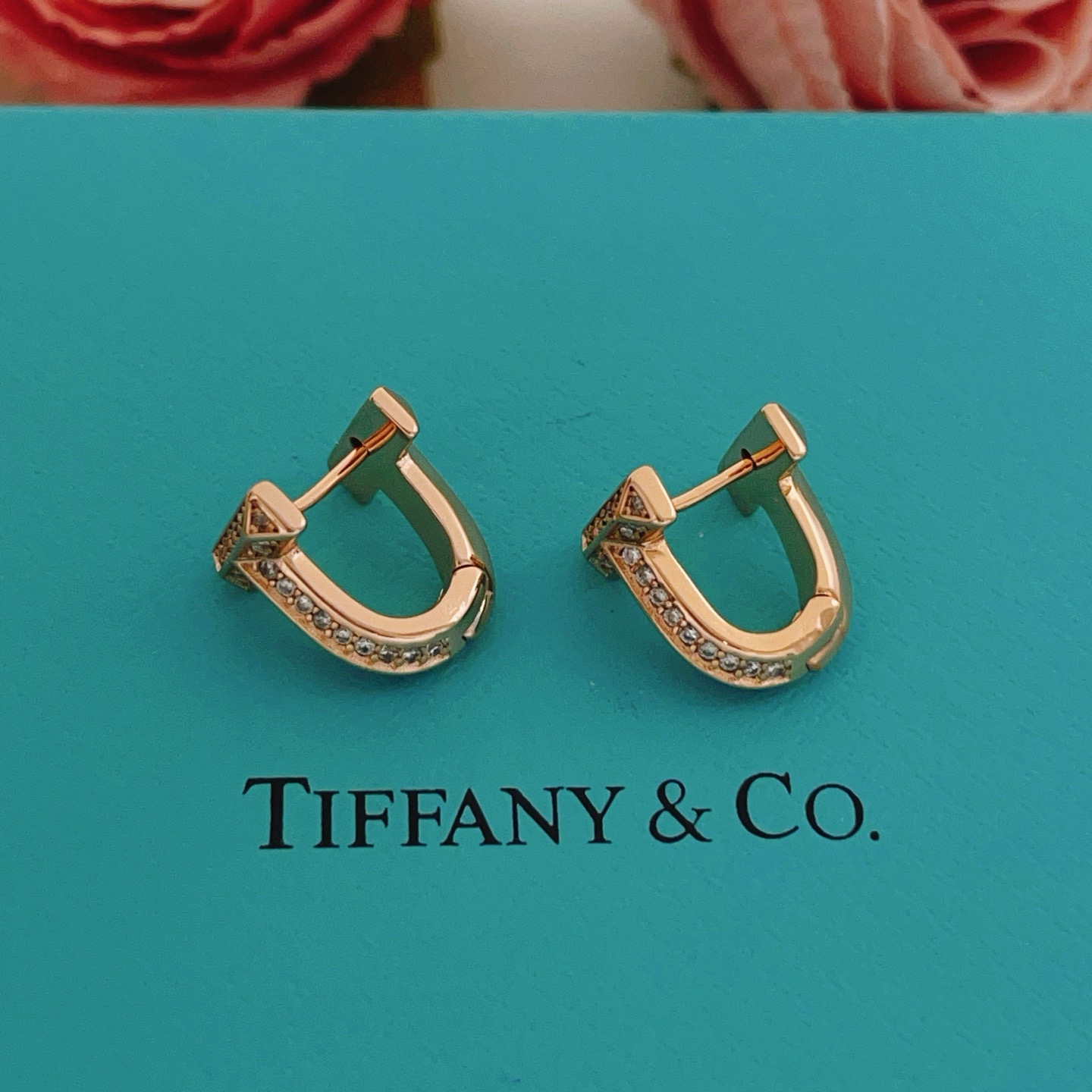 Tiffany Co Tiffany T earrings 18k rose gold with pave set clear diamonds 12mm hoop diameter