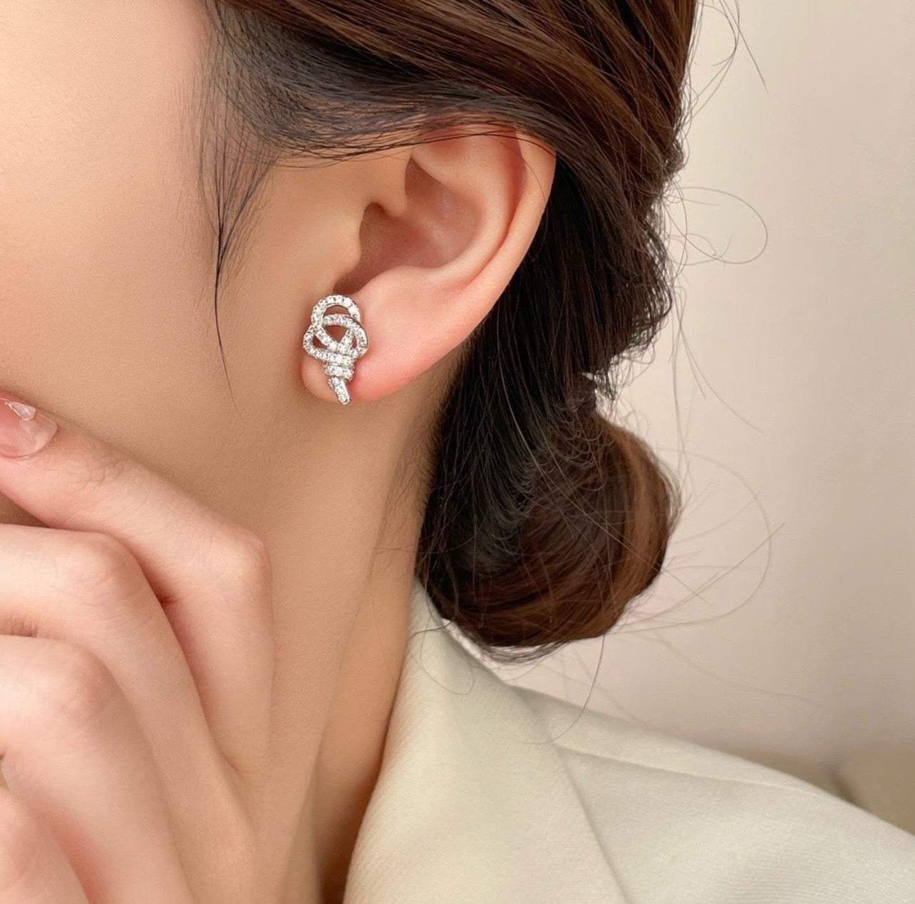 Tiffany Co Knot earrings silver-toned metal with clear diamond pave 1 5cm stud length