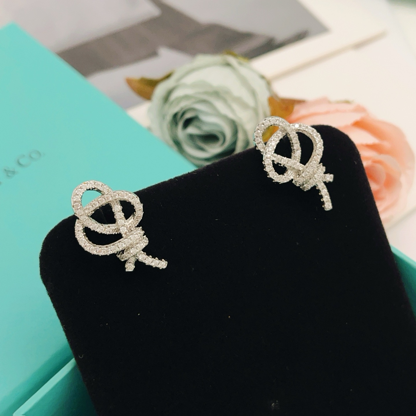 Tiffany Co Knot earrings silver-toned metal with clear diamond pave 1 5cm stud length