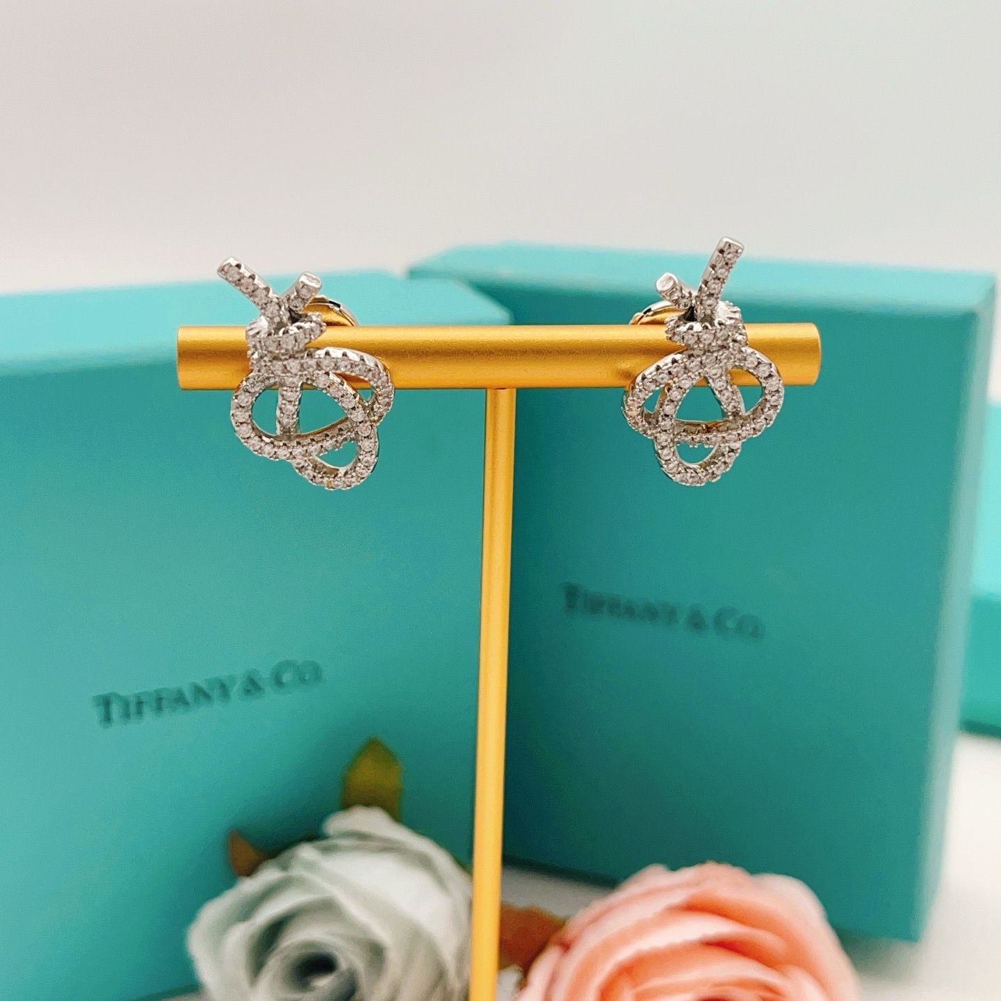 Tiffany Co Knot earrings silver-toned metal with clear diamond pave 1 5cm stud length