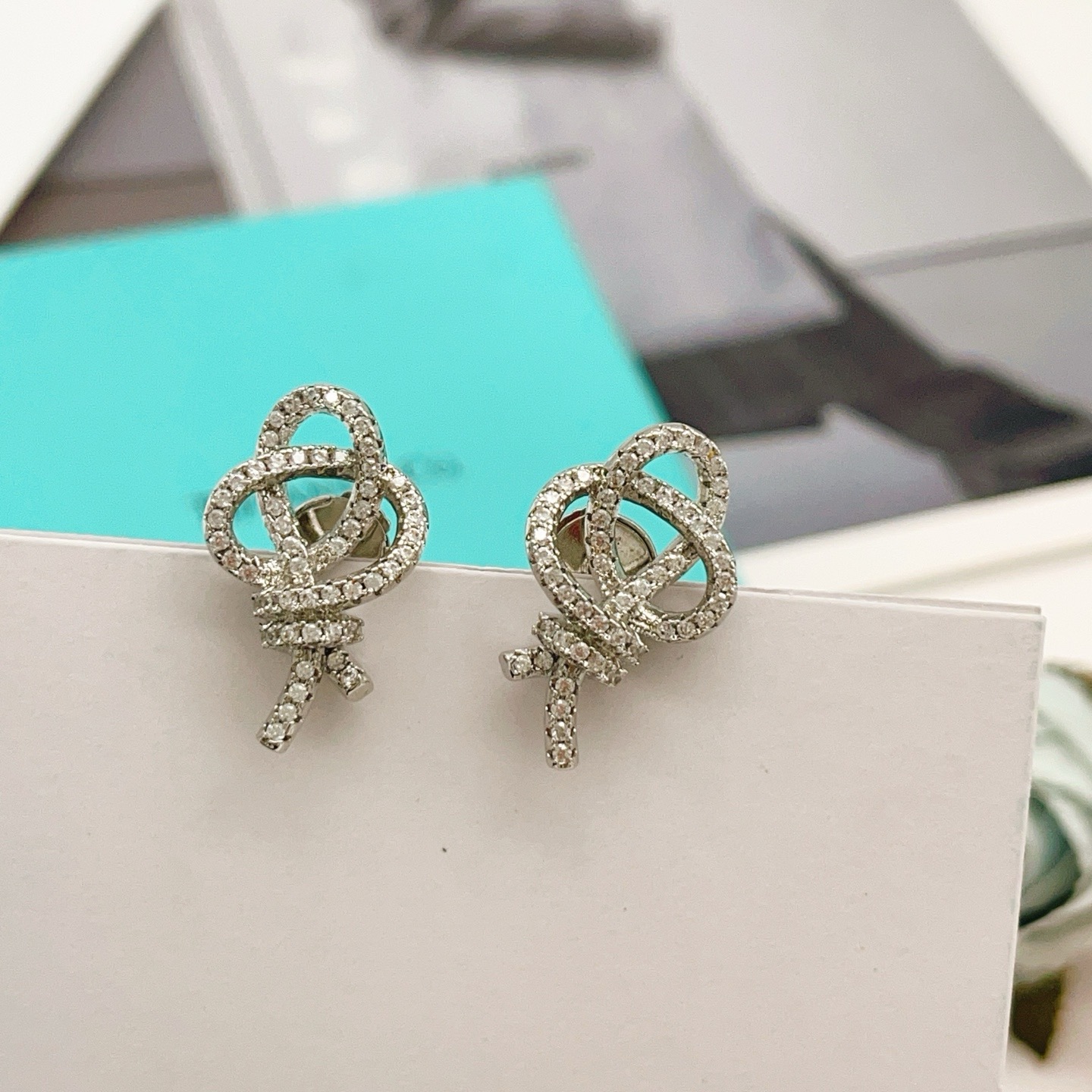 Tiffany Co Knot earrings silver-toned metal with clear diamond pave 1 5cm stud length