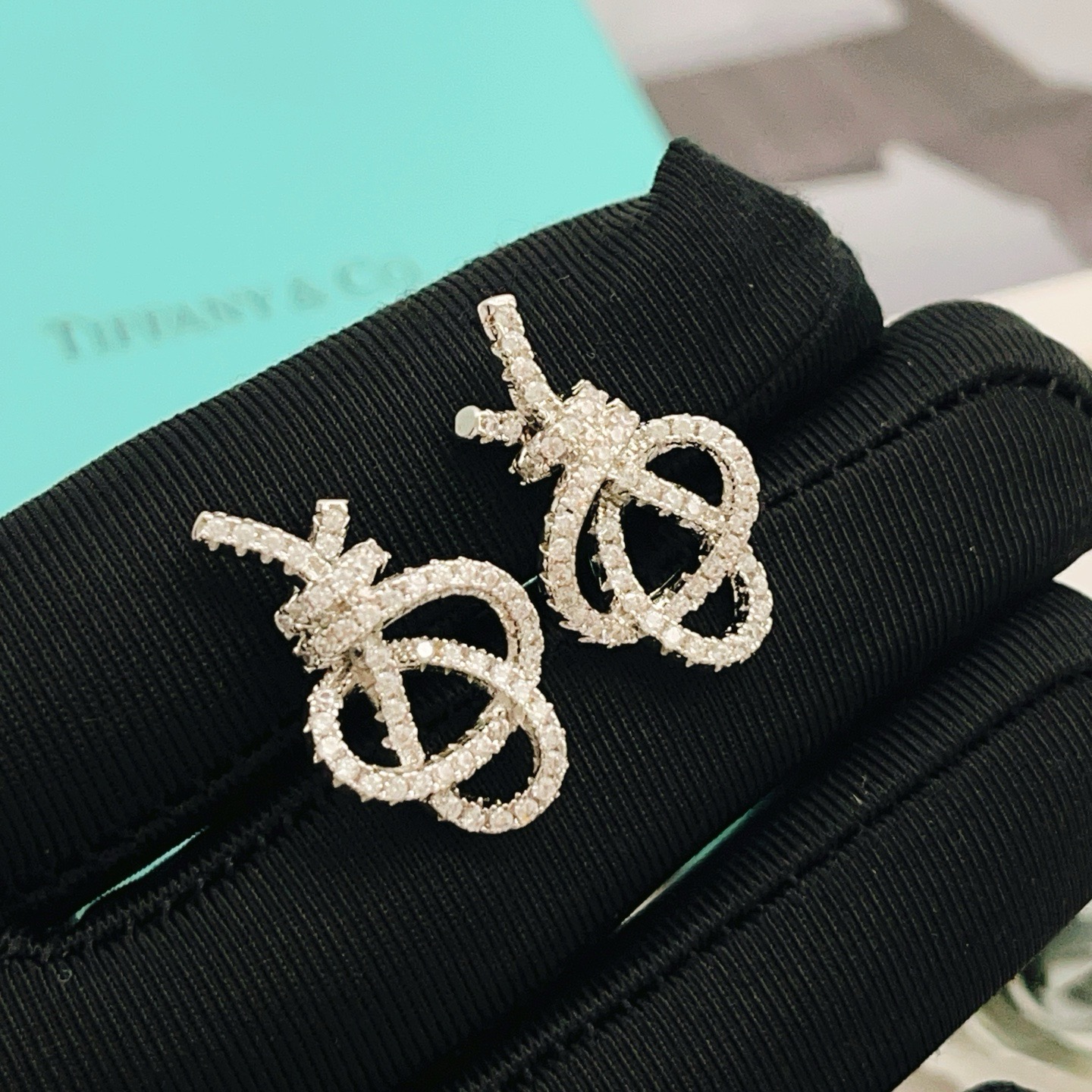 Tiffany Co Knot earrings silver-toned metal with clear diamond pave 1 5cm stud length