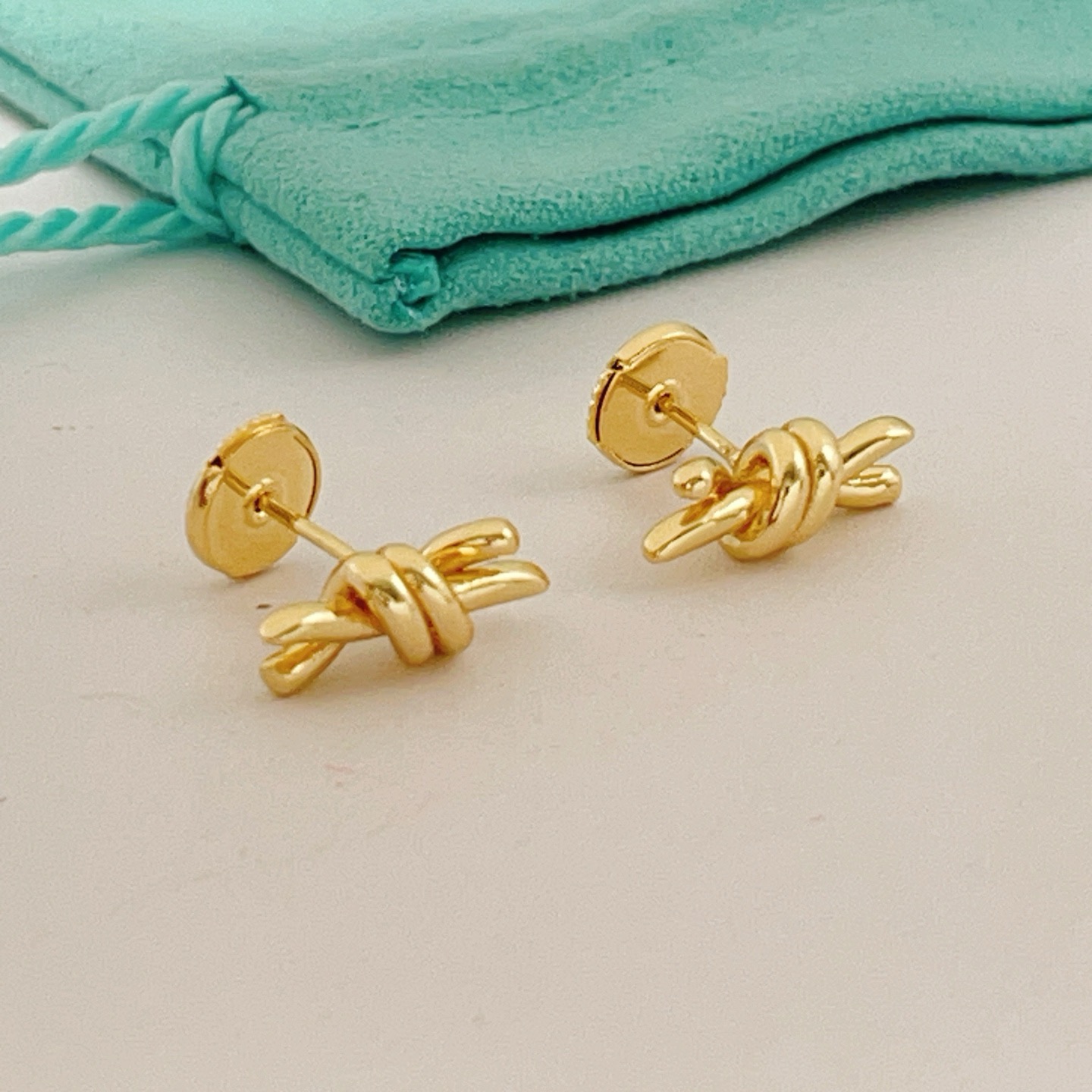 Tiffany Knot earrings gold tone metal no gemstones 12mm width