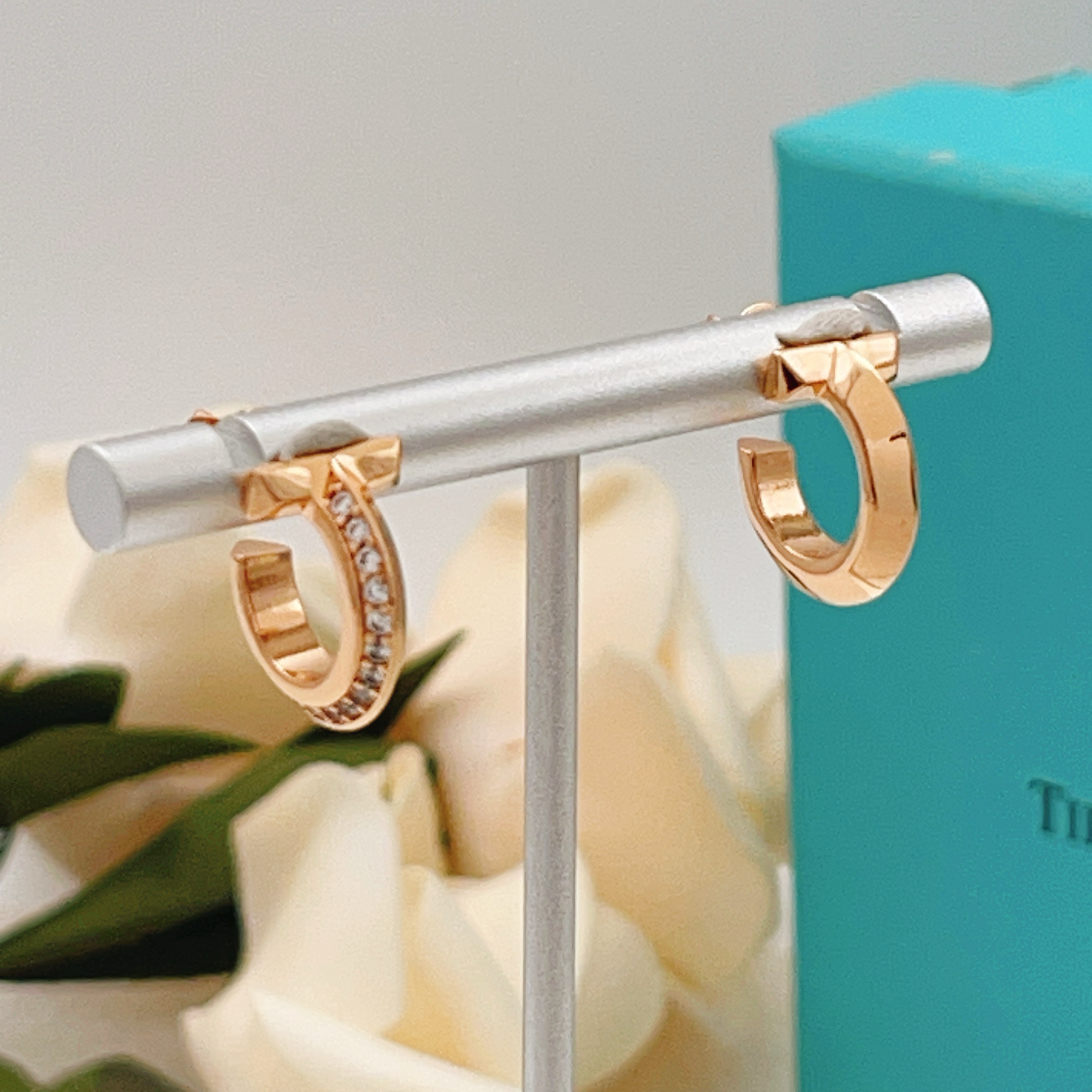Tiffany T1 earrings rose gold metal with clear diamond accents 10mm hoop diameter