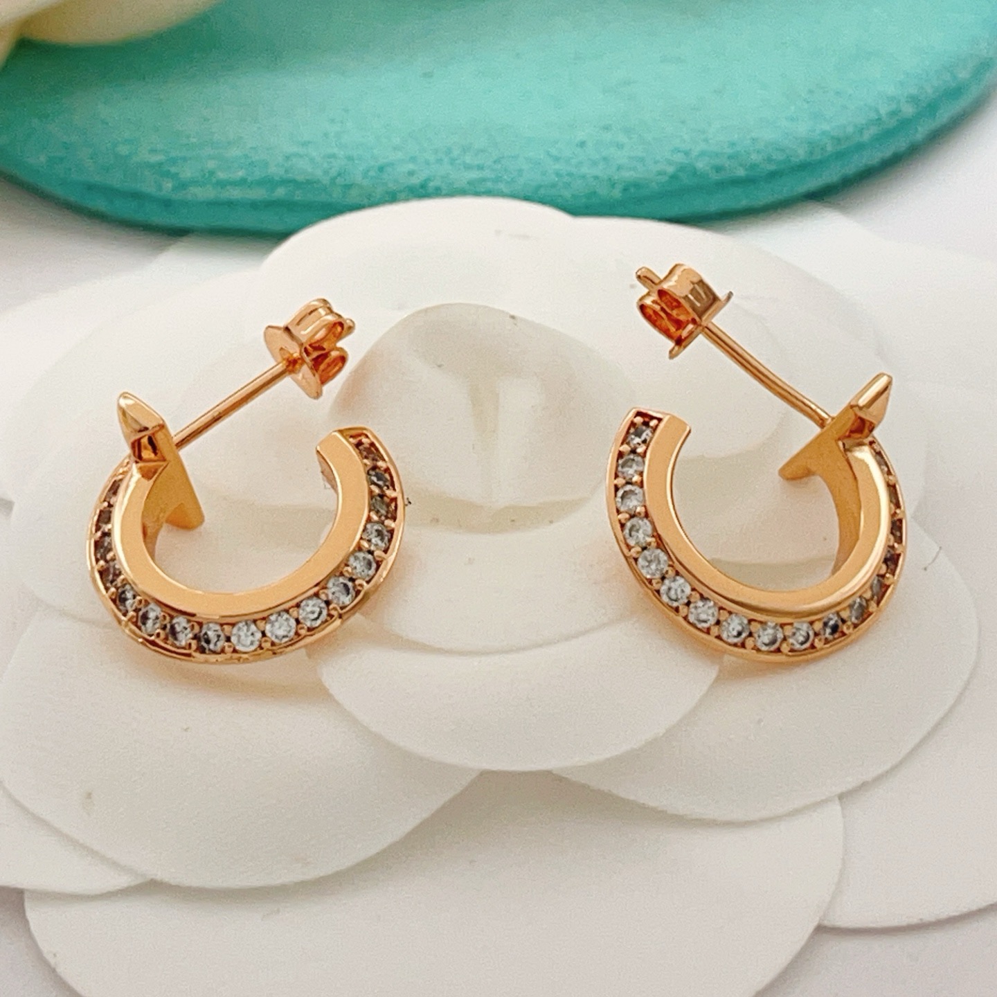 Tiffany T1 earrings rose gold metal with clear diamond accents 10mm hoop diameter