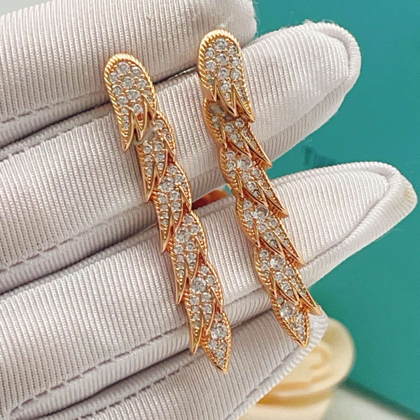 Tiffany Co Feather Drop earrings Rose gold metal with clear diamond-like gemstones 4 5cm length