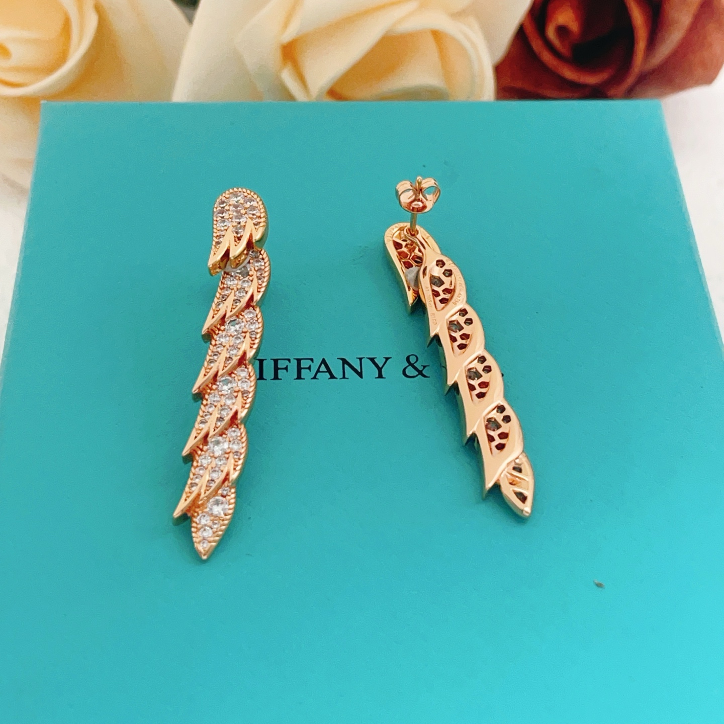 Tiffany Co Feather Drop earrings Rose gold metal with clear diamond-like gemstones 4 5cm length
