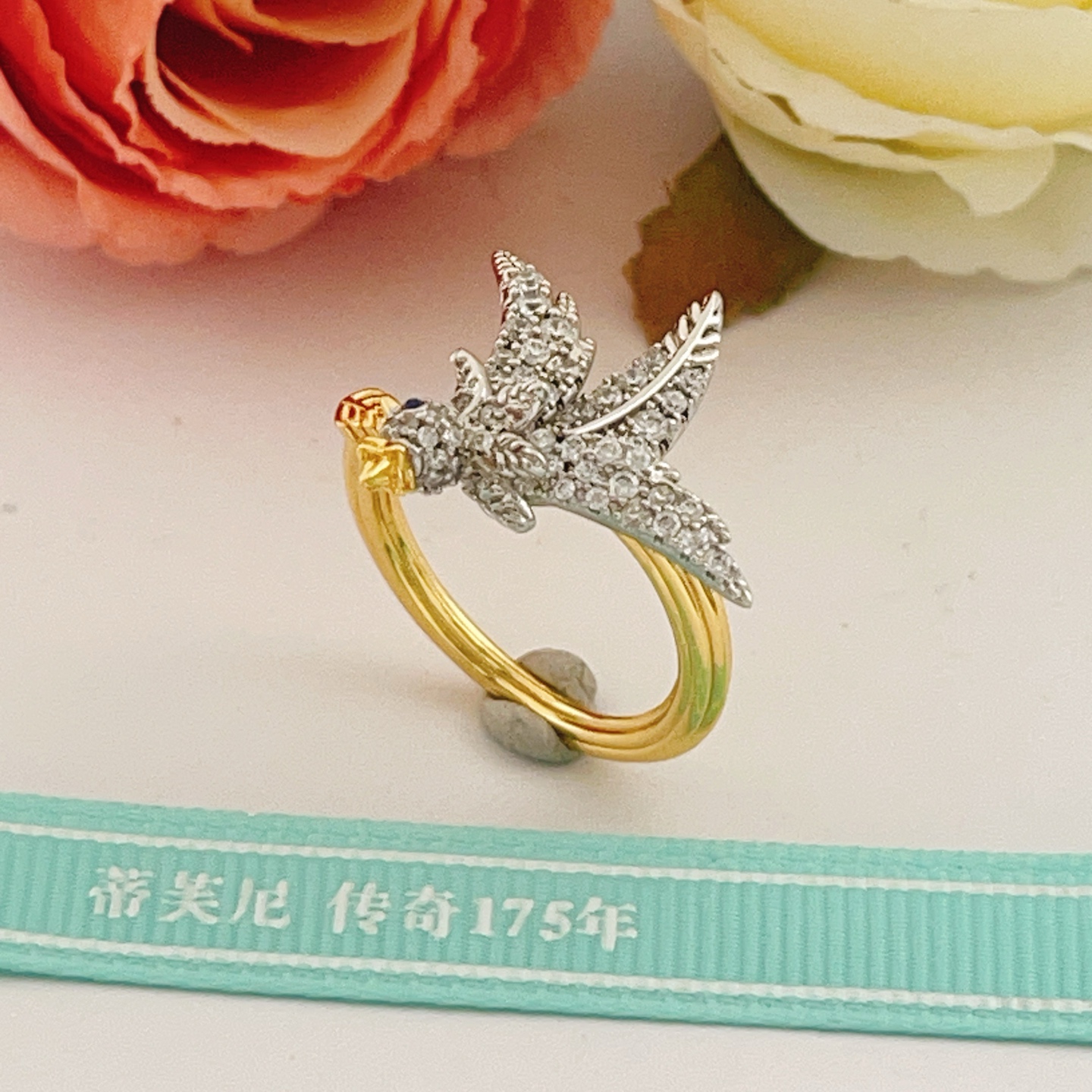 Tiffany Co 175th Anniversary Bird on a Wheat ring Two-tone yellow gold and platinum-plated metal clear pave diamonds blue sapphire eye US 7