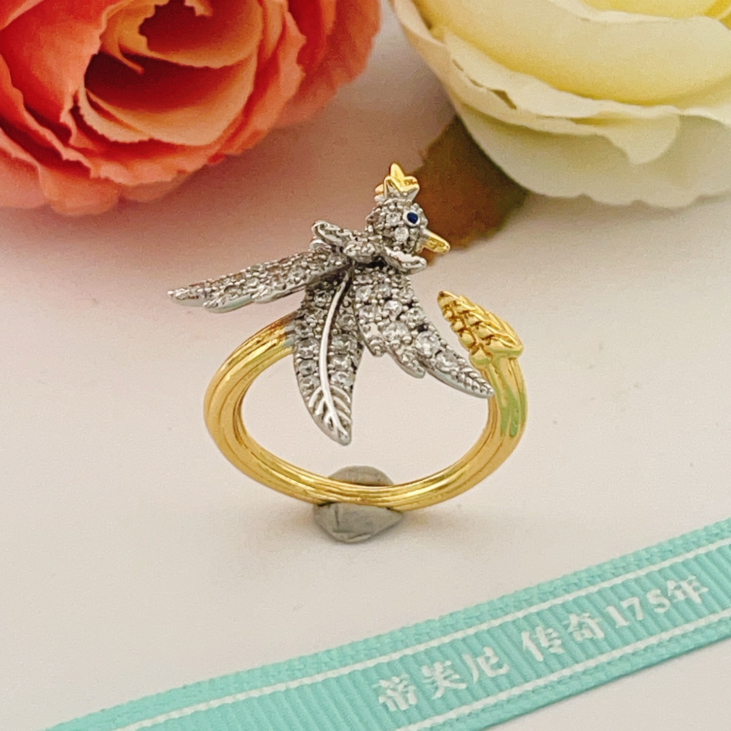 Tiffany Co 175th Anniversary Bird on a Wheat ring Two-tone yellow gold and platinum-plated metal clear pave diamonds blue sapphire eye US 7