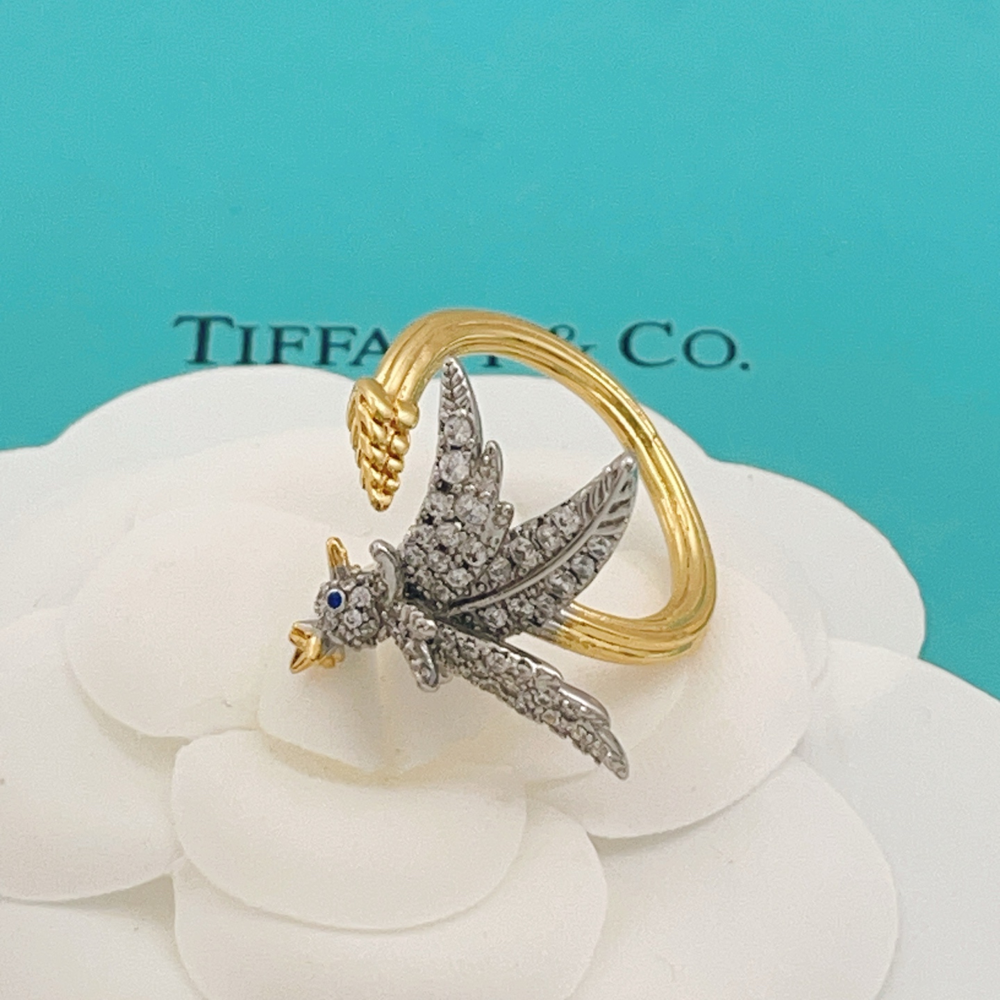 Tiffany Co 175th Anniversary Bird on a Wheat ring Two-tone yellow gold and platinum-plated metal clear pave diamonds blue sapphire eye US 7