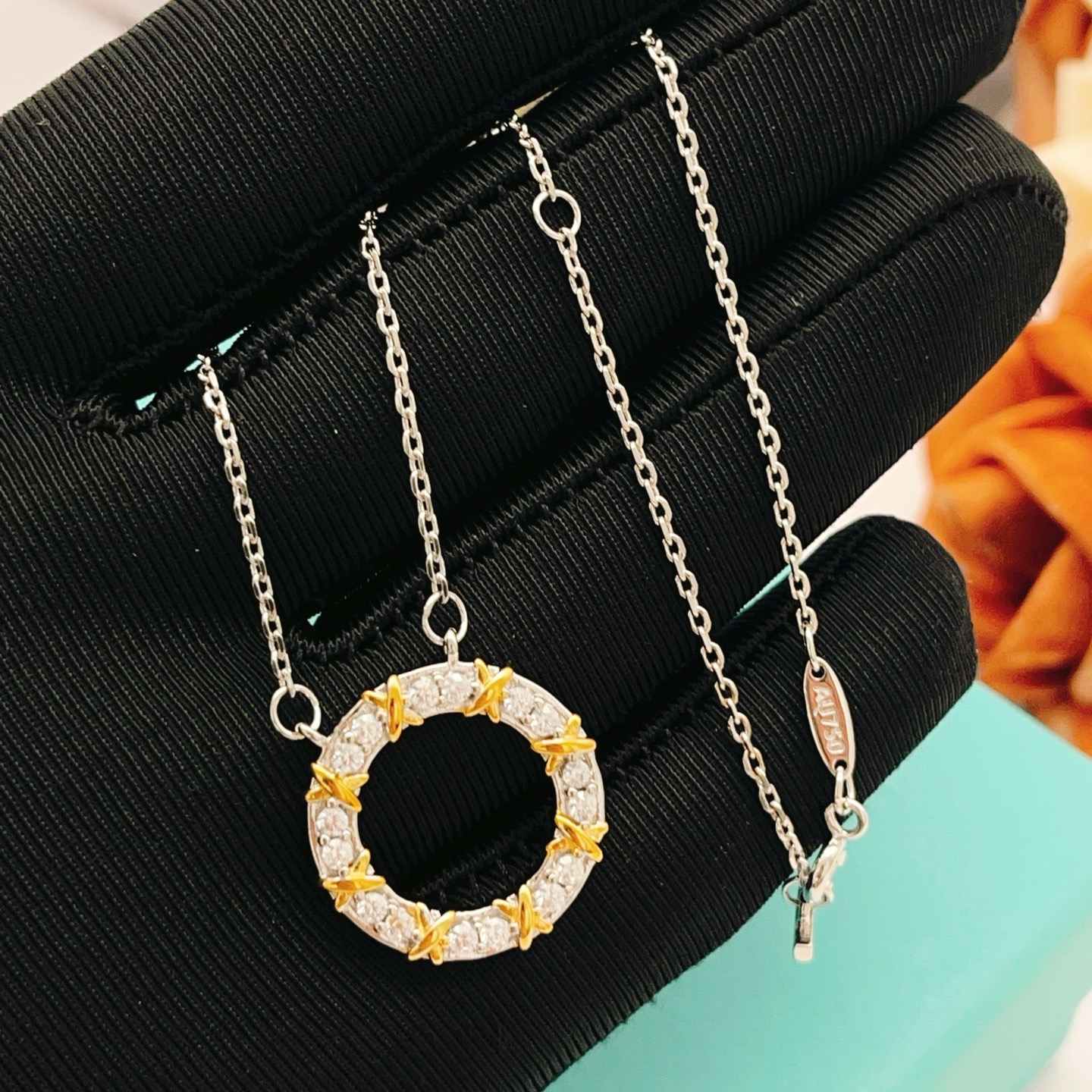 Tiffany Co Schlumberger X Circle Pendant necklace Sterling silver and 18k gold with clear diamonds 16 inches
