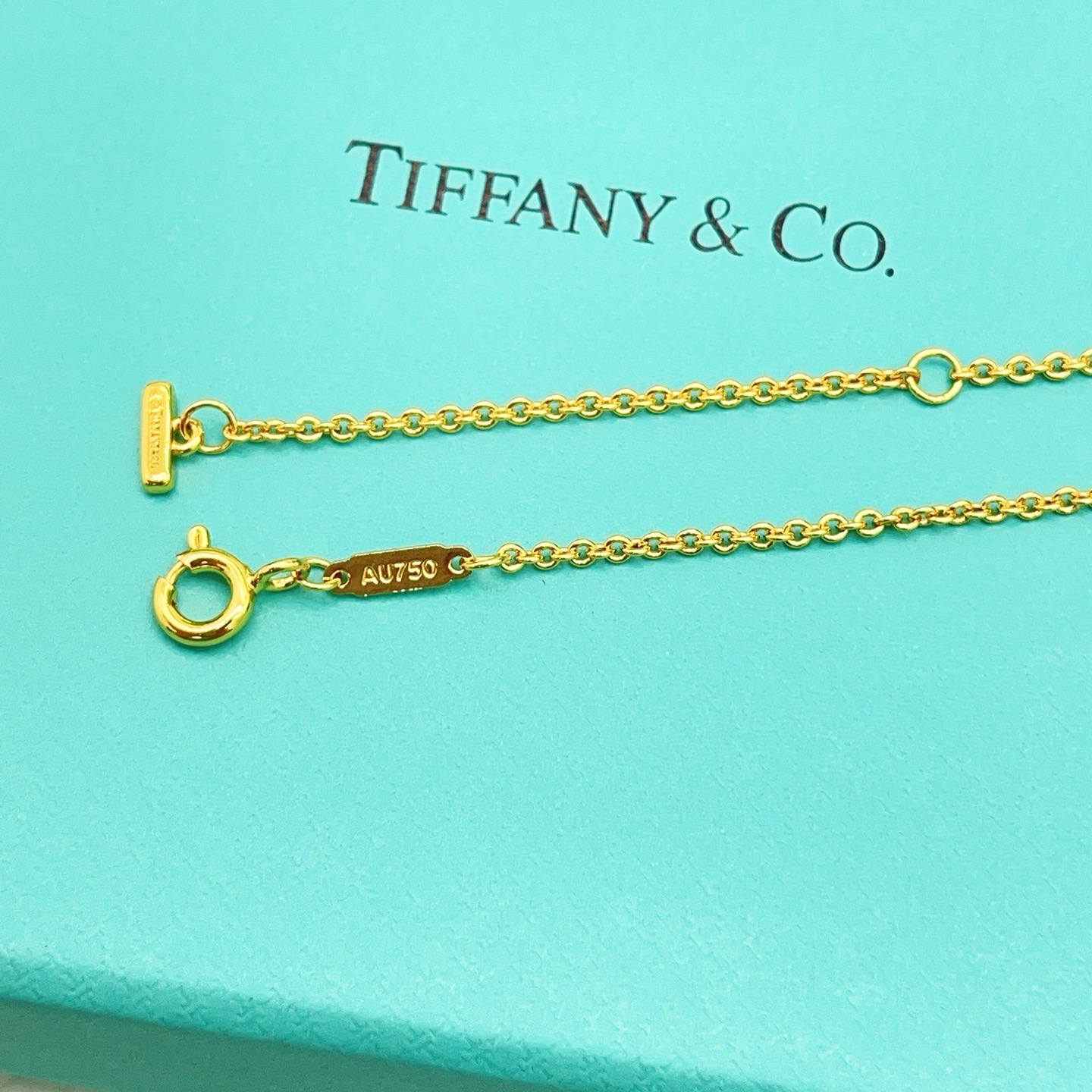 Tiffany Co T Smile necklace 18k yellow gold with clear diamond accents 16-18 inch adjustable chain