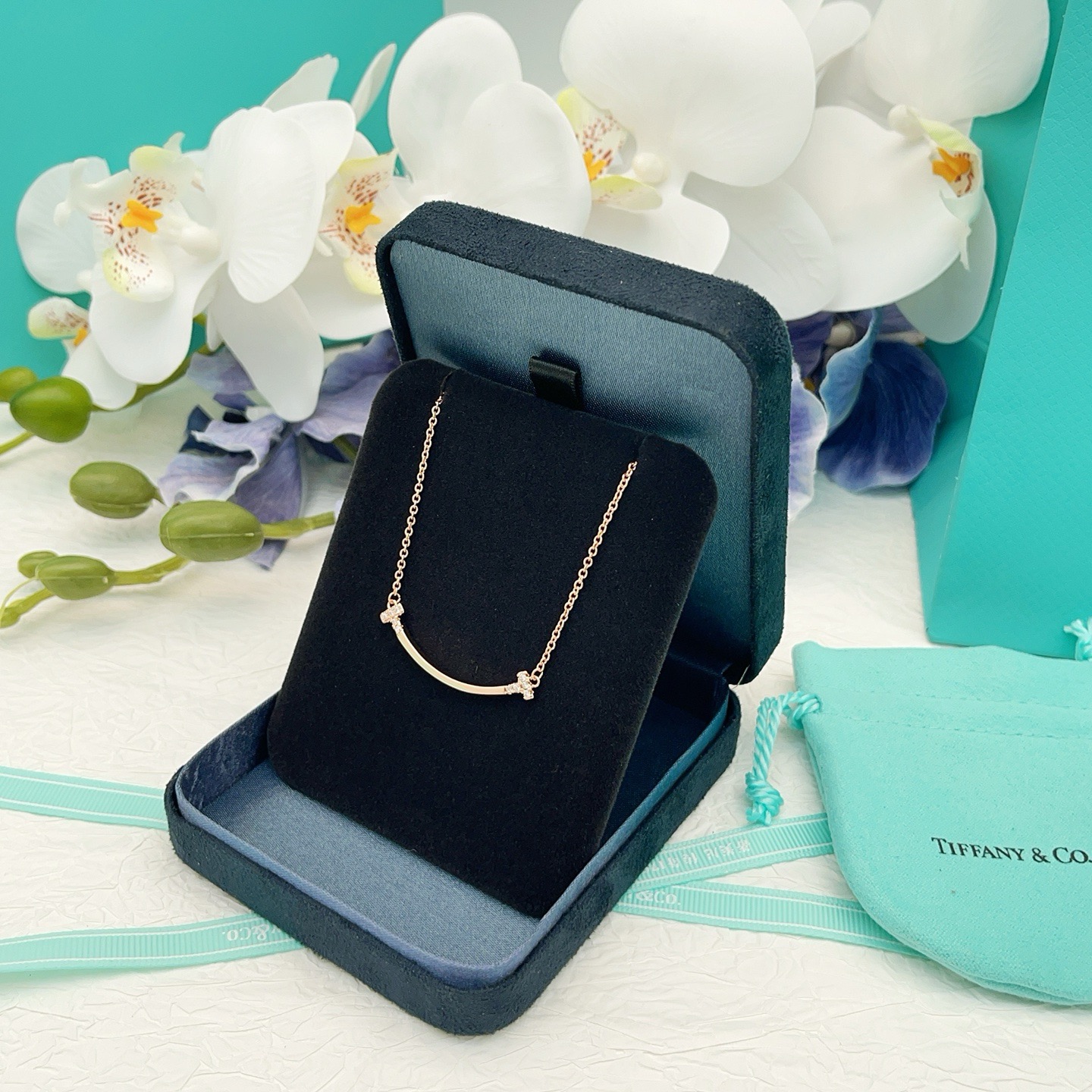 Tiffany Co T Smile necklace 18k yellow gold 18k white gold 18k rose gold with clear diamond accents 16-18 inch adjustable chain