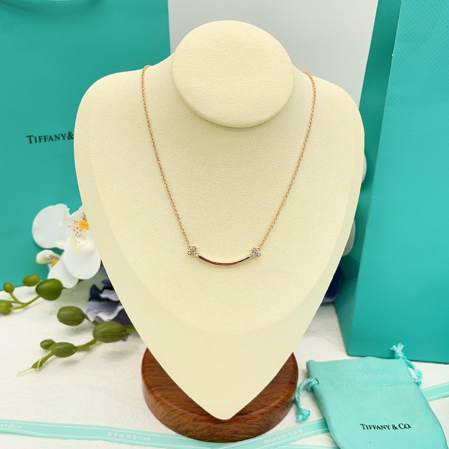 Tiffany Co T Smile necklace 18k yellow gold 18k white gold 18k rose gold with clear diamond accents 16-18 inch adjustable chain