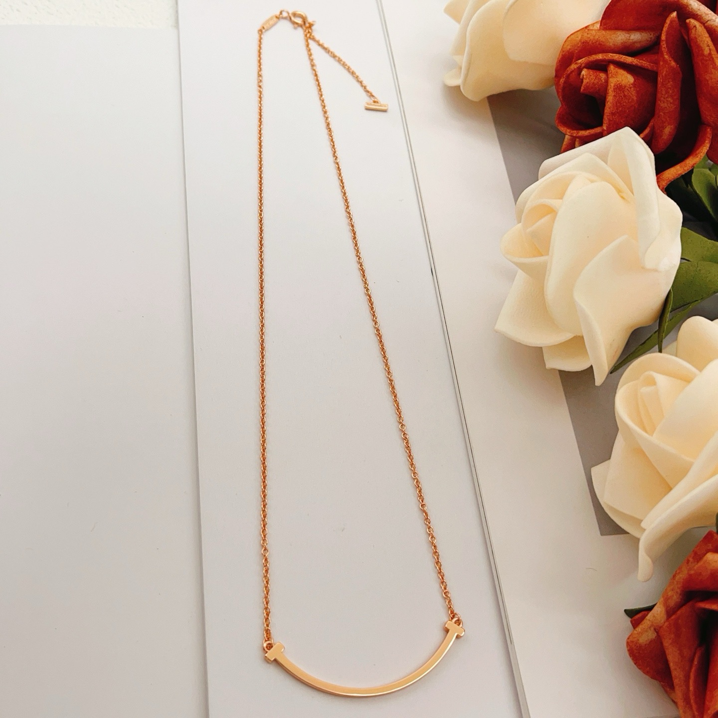 Tiffany Co T Smile necklace Available in 18k yellow gold 18k rose gold and sterling silver no gemstones 45cm