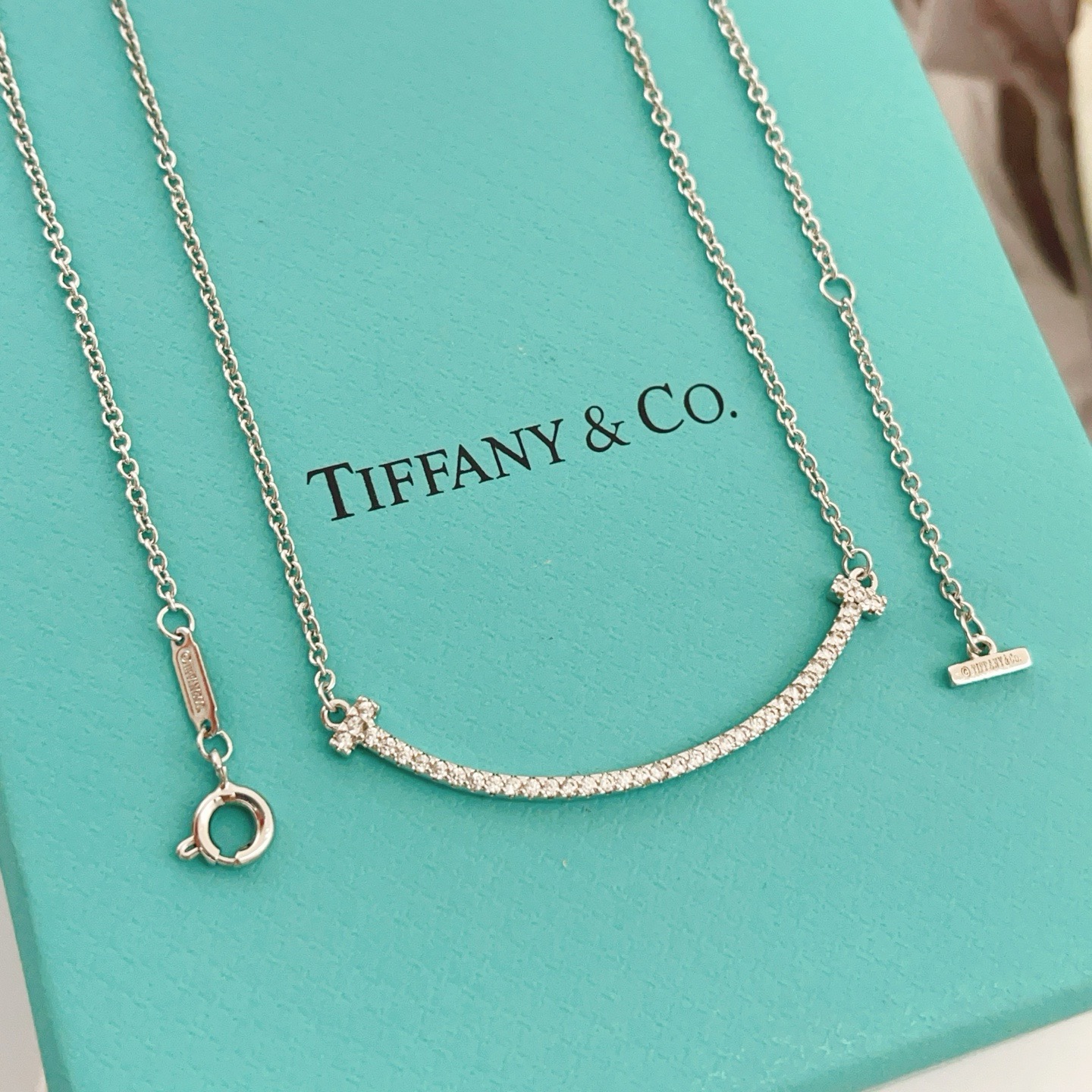 Tiffany Co T Smile necklace silver-toned white gold with clear diamond accents 16-18 inches adjustable