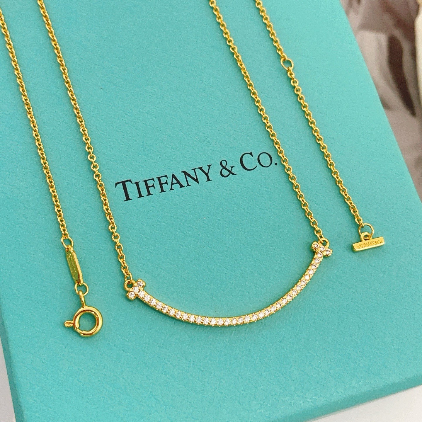 Tiffany Co T Smile necklace yellow gold with clear diamond accents 16-18 inches adjustable