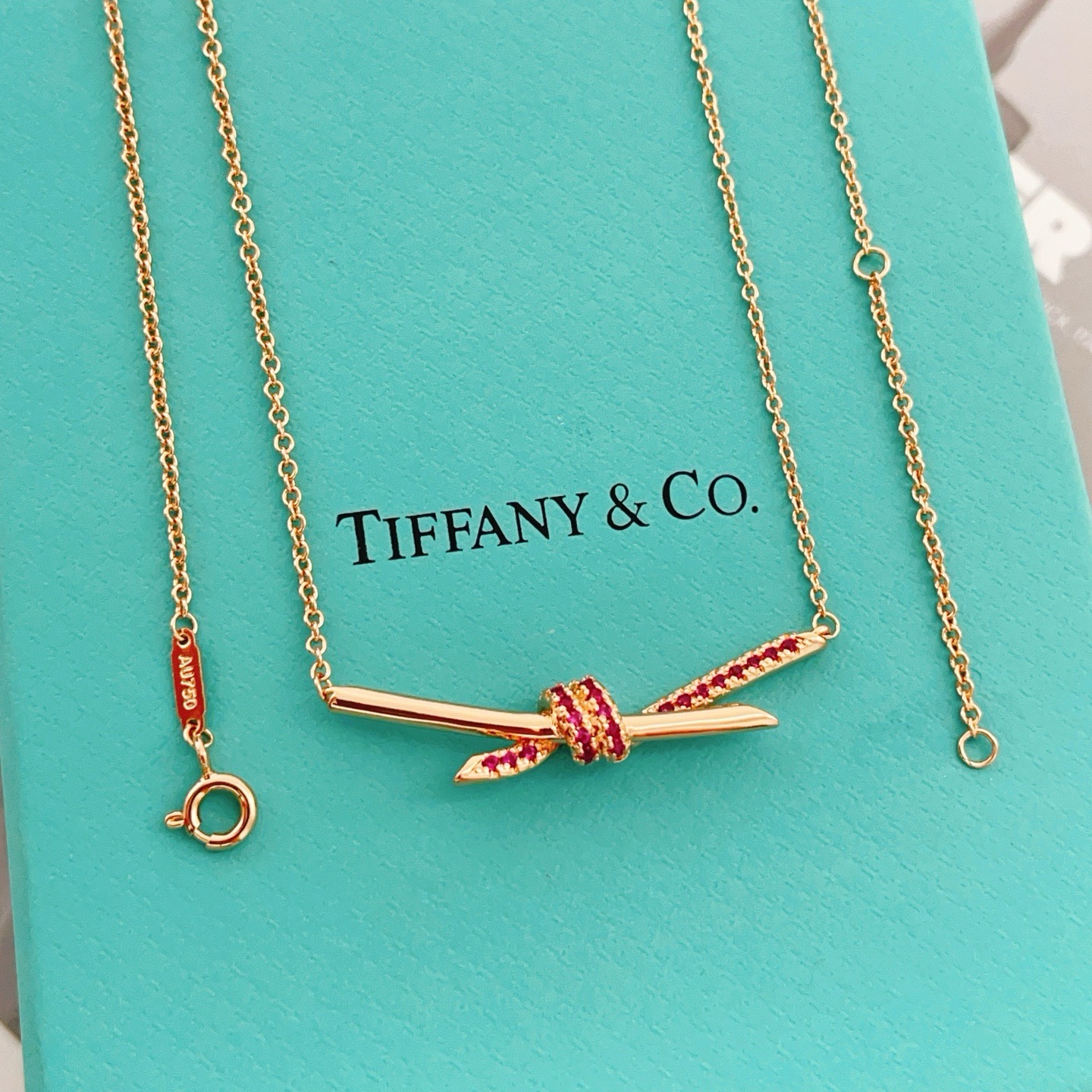 Tiffany Co Knot necklace 18K rose gold with ruby red gemstones 40-45cm adjustable