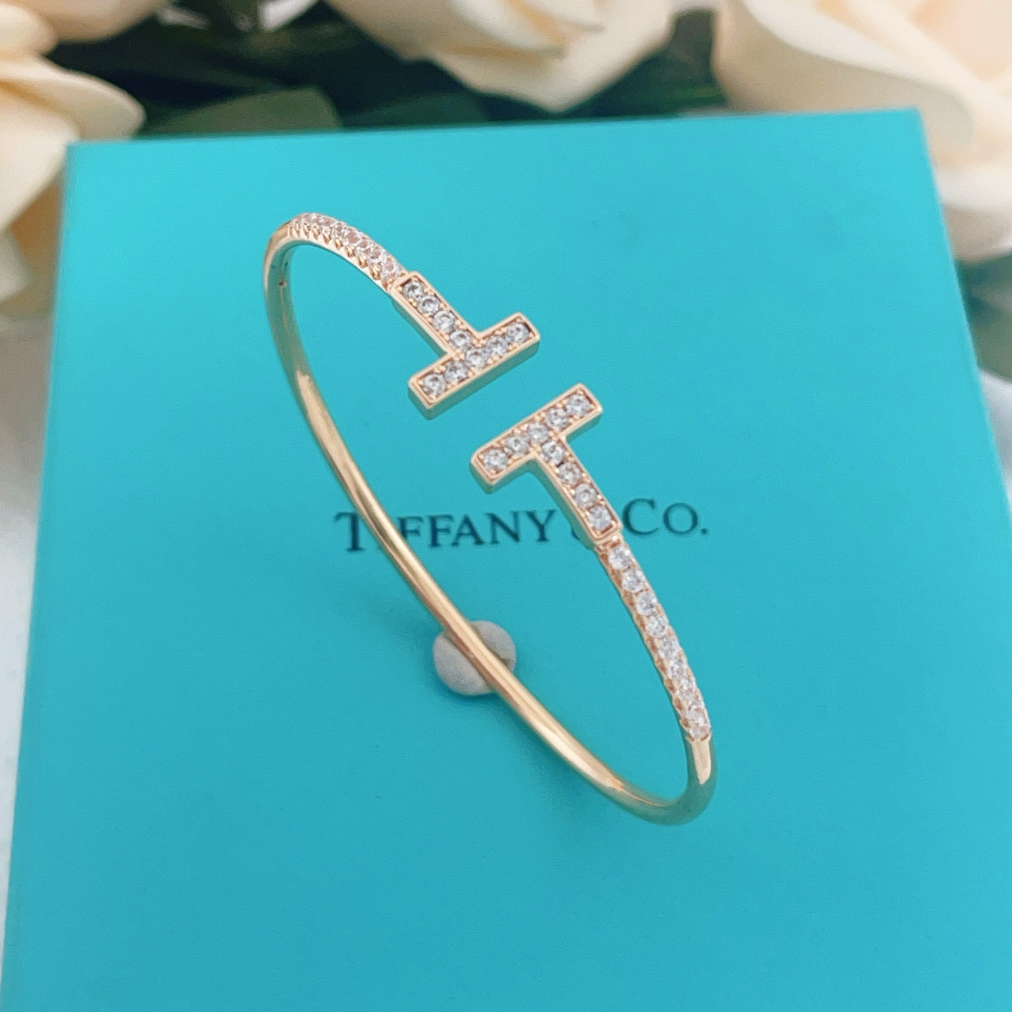 Tiffany T Wire bracelet 18k gold 18k rose gold sterling silver with clear diamond accents 17cm inner circumference