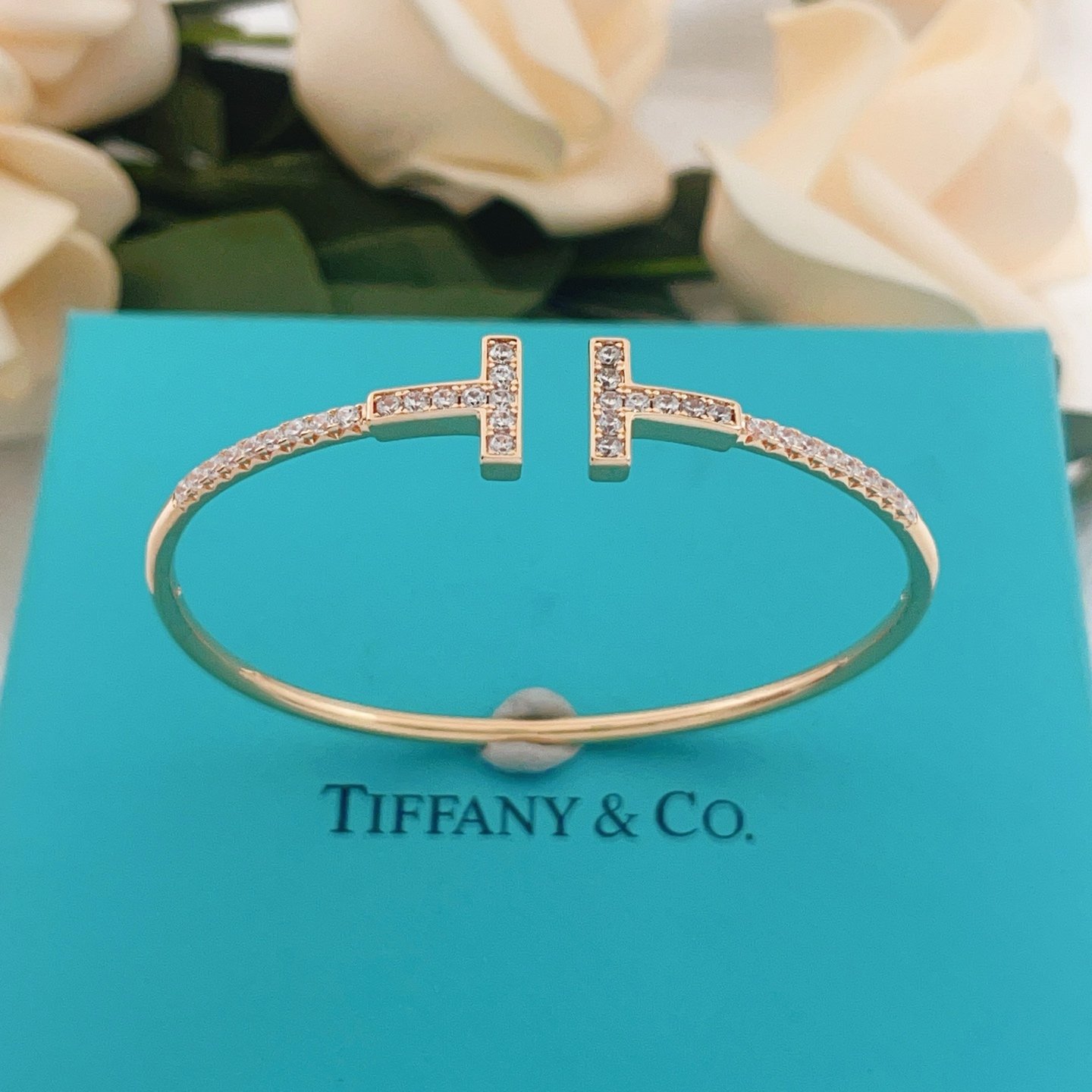 Tiffany T Wire bracelet 18k gold 18k rose gold sterling silver with clear diamond accents 17cm inner circumference