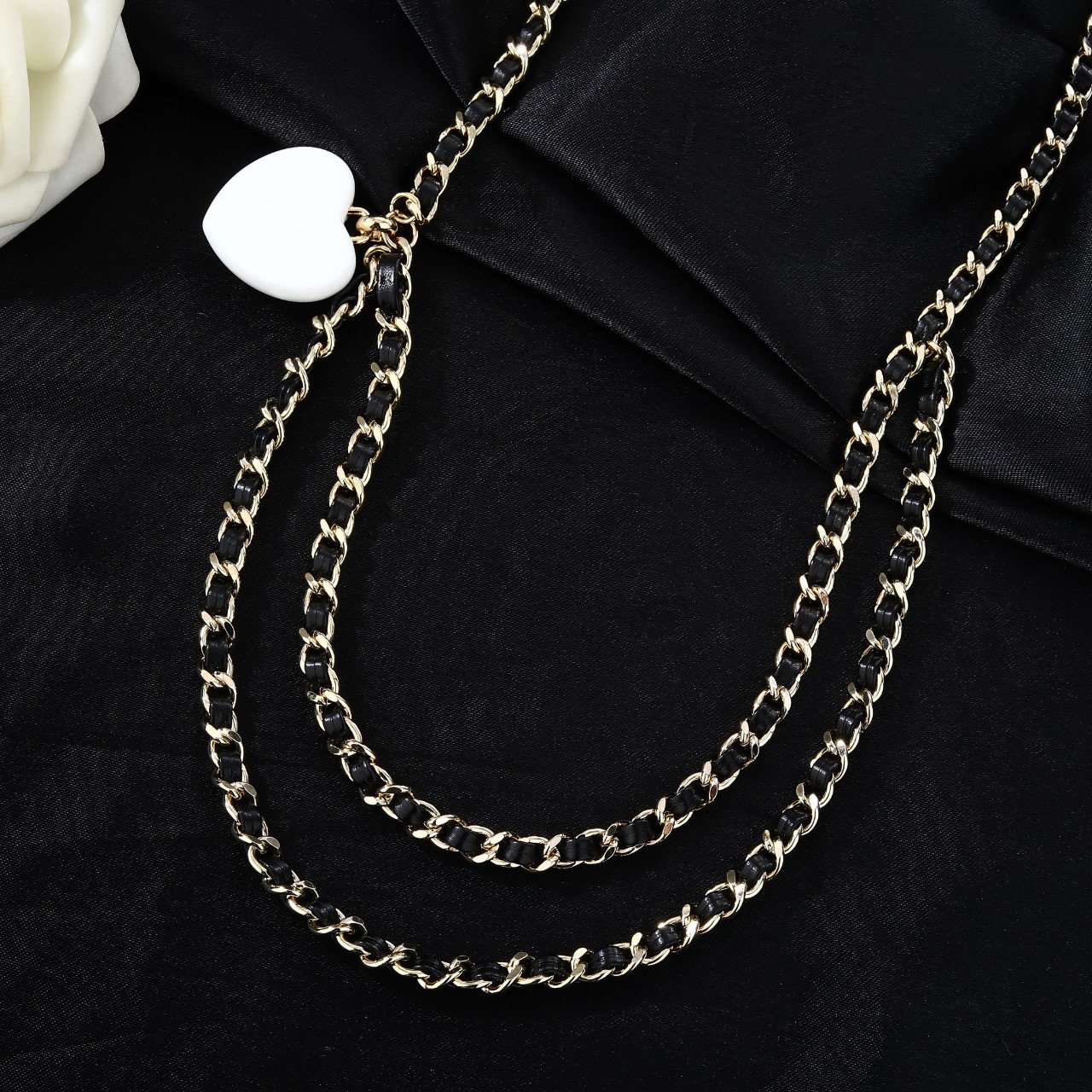 Chanel Goose Heart CC Pendant Waist Chain necklace Gold-tone metal black leather white resin heart pendant black enamel clear crystal accents 80cm with 10cm extender