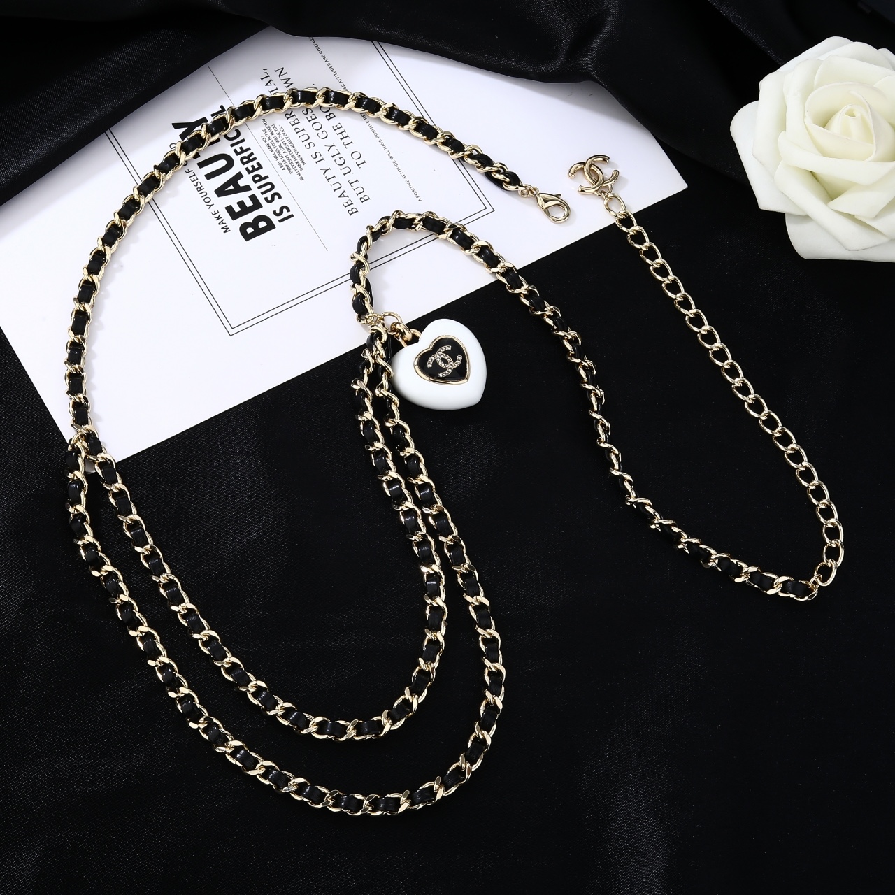 Chanel Goose Heart CC Pendant Waist Chain necklace Gold-tone metal black leather white resin heart pendant black enamel clear crystal accents 80cm with 10cm extender