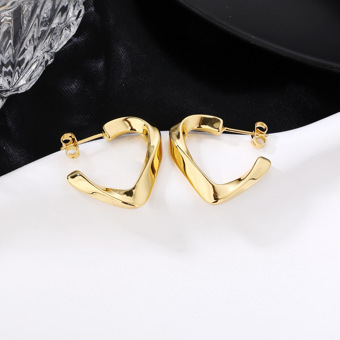 Celine Twisted Open Heart Hoop Earrings earrings polished gold-tone metal no accent stones 2 5cm hoop diameter