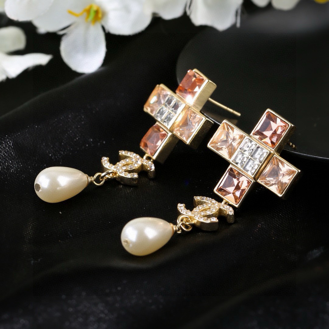 Chanel CC Cross Crystal Pearl Drop Earrings earrings Gold-tone metal with champagne clear crystals cream teardrop faux pearls variant with red crystals also exists 4 5cm drop length