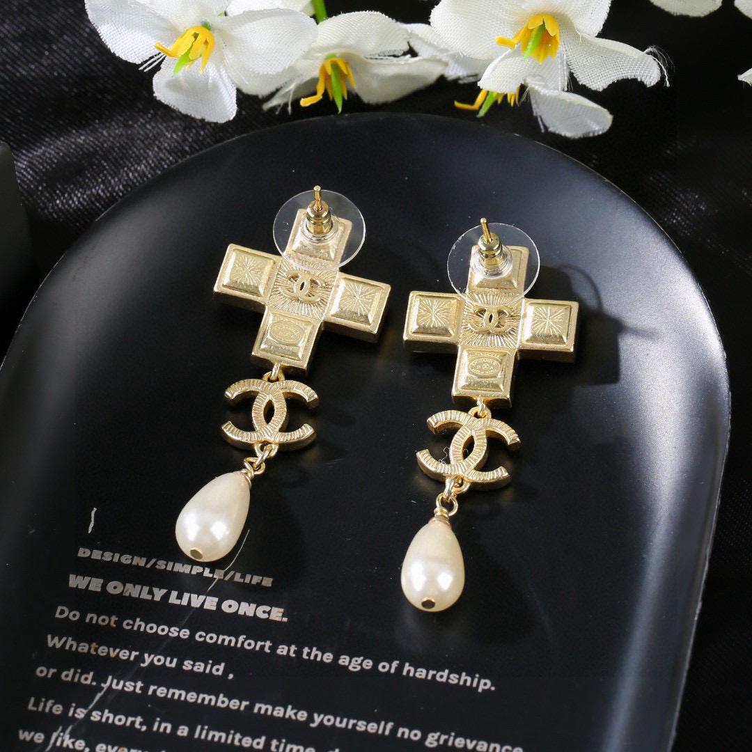 Chanel CC Cross Crystal Pearl Drop Earrings earrings Gold-tone metal with champagne clear crystals cream teardrop faux pearls variant with red crystals also exists 4 5cm drop length