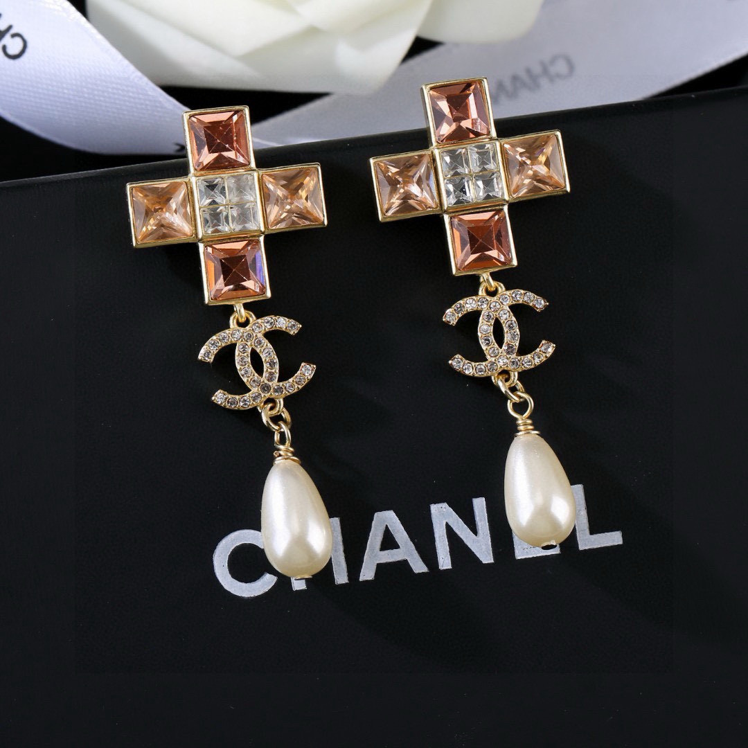 Chanel CC Cross Crystal Pearl Drop Earrings earrings Gold-tone metal with champagne clear crystals cream teardrop faux pearls variant with red crystals also exists 4 5cm drop length