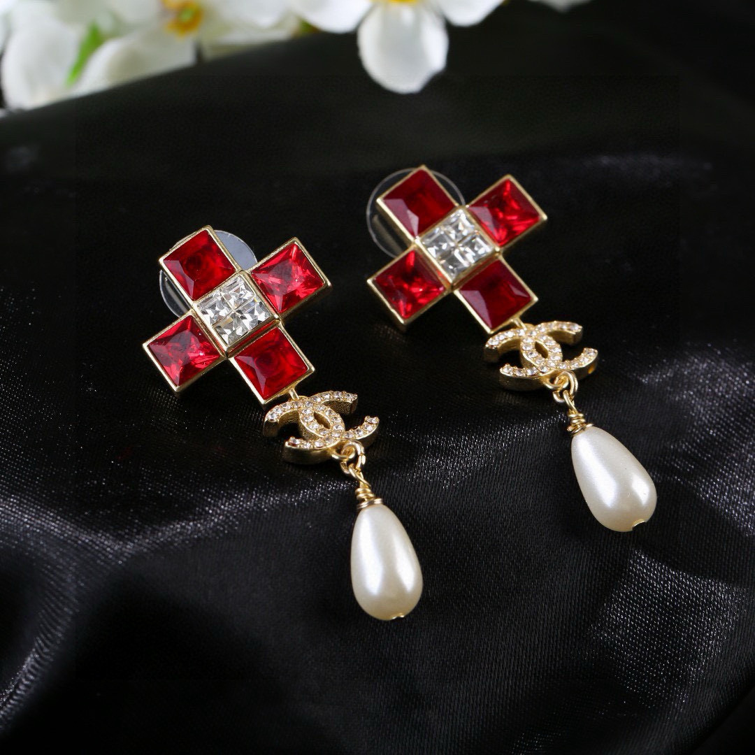 Chanel CC Cross Crystal Pearl Drop Earrings earrings Gold-tone metal with champagne clear crystals cream teardrop faux pearls variant with red crystals also exists 4 5cm drop length