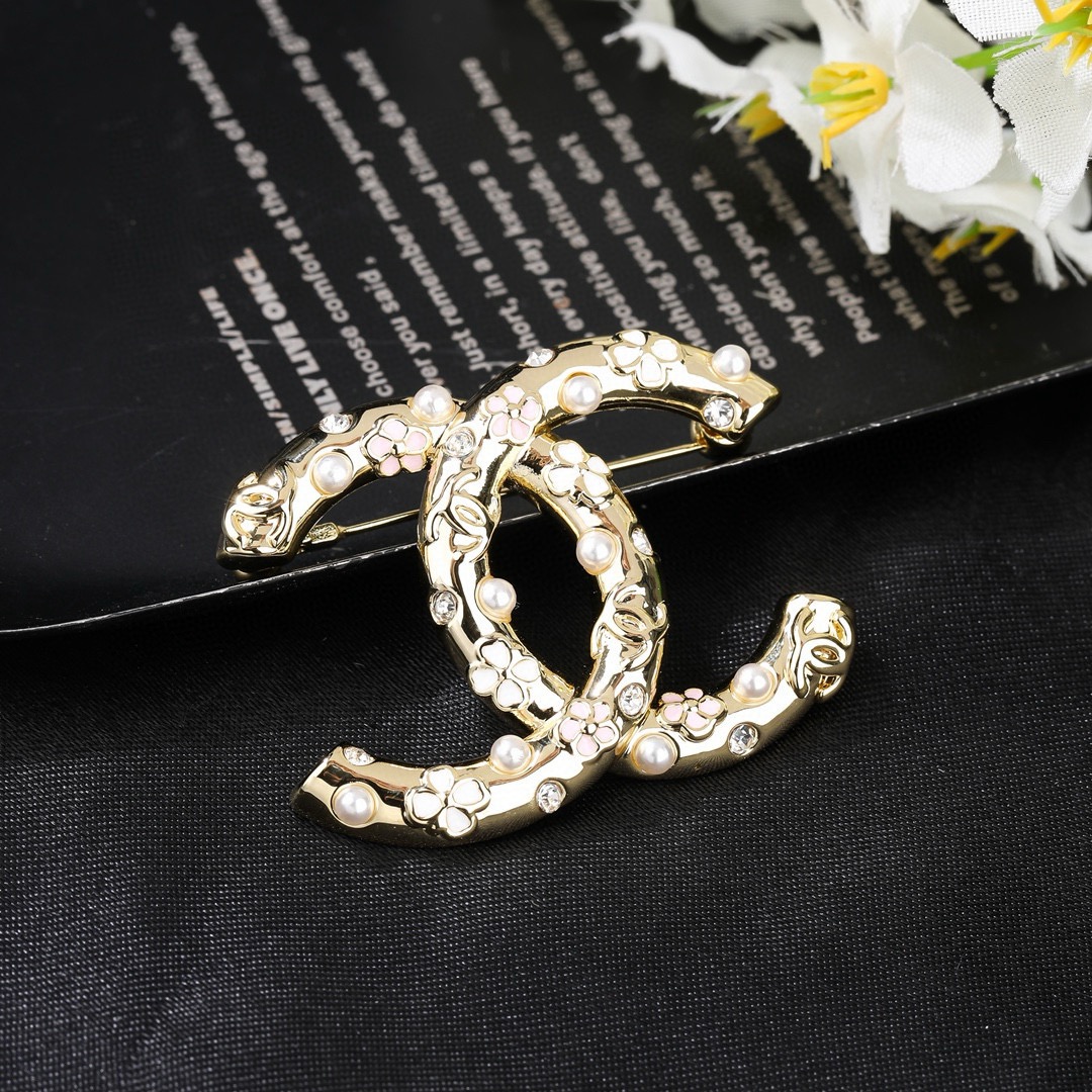 Chanel CC Logo Floral Pearl Crystal Brooch brooch gold tone metal white faux pearl clear crystal pink and white enamel floral accents 3 5cm width
