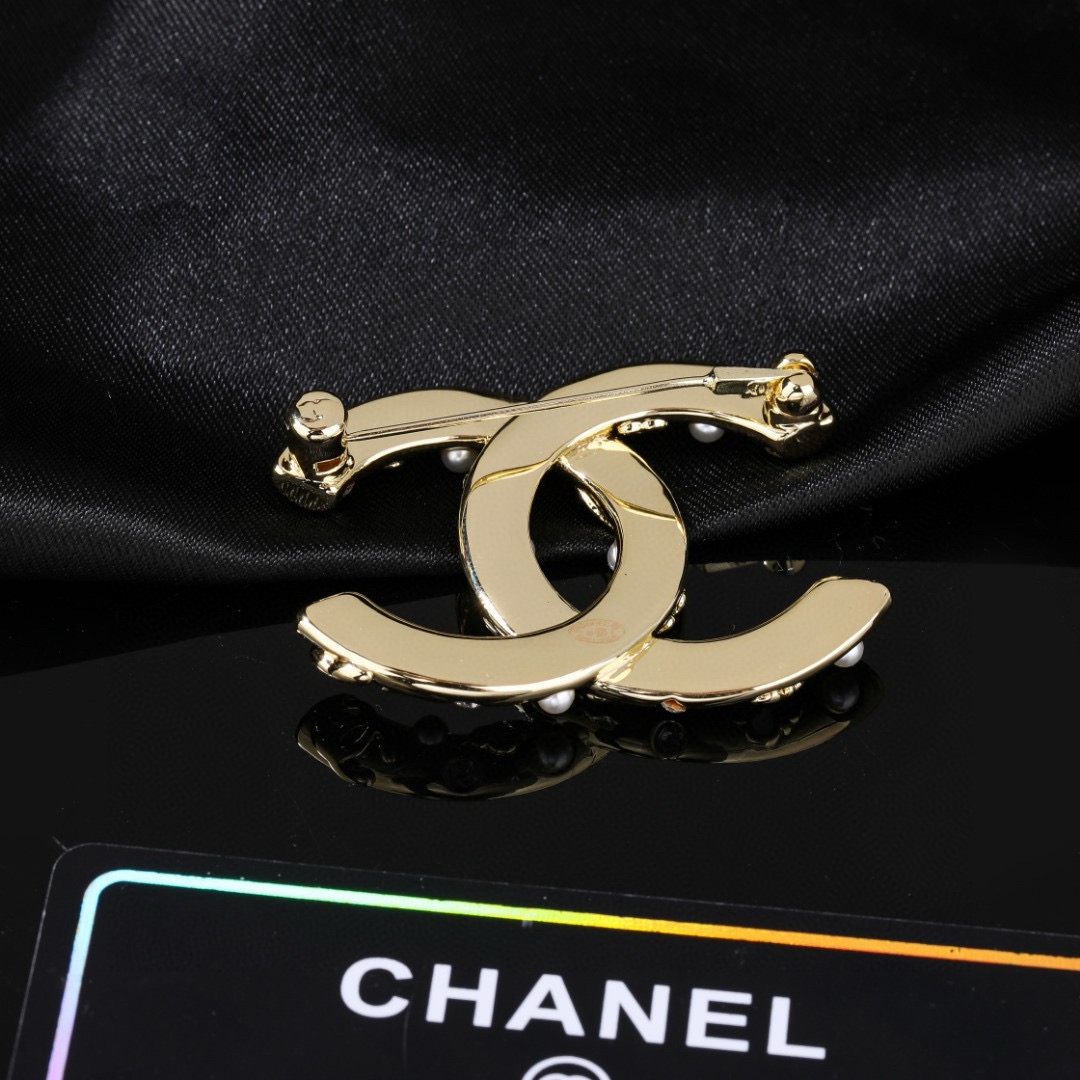 Chanel CC Logo Floral Pearl Crystal Brooch brooch gold tone metal white faux pearl clear crystal pink and white enamel floral accents 3 5cm width