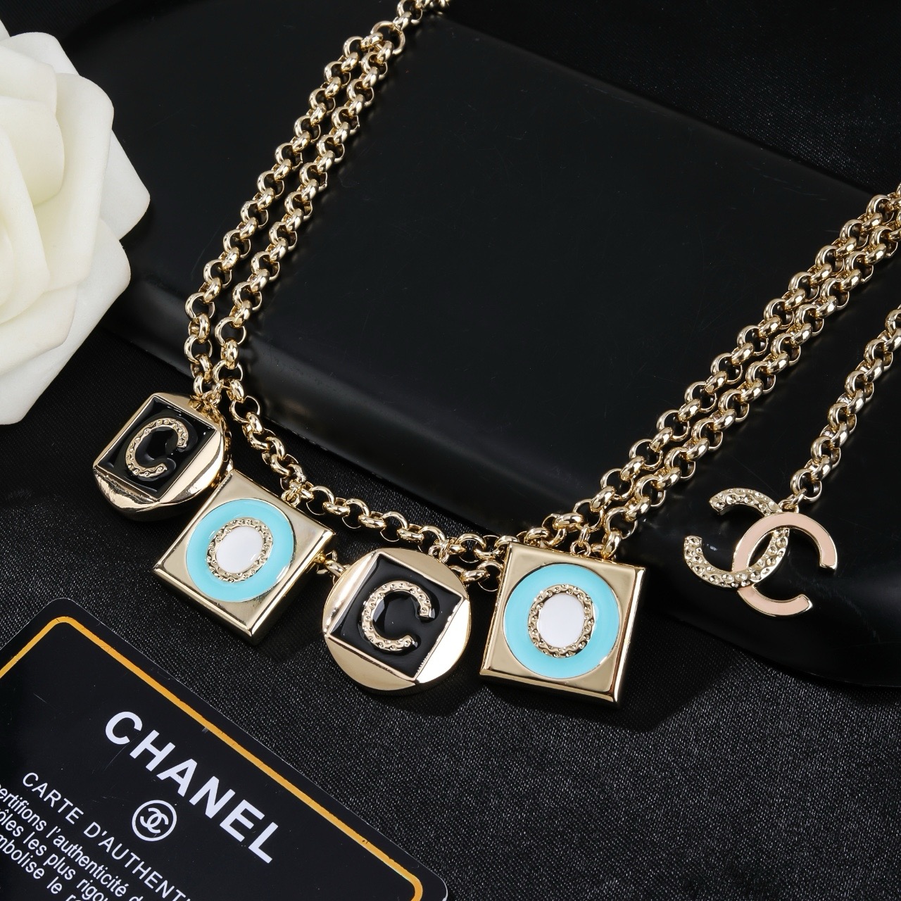 Chanel Coco Charms Double Chain necklace Light gold tone metal black enamel turquoise blue enamel white enamel clear crystal accents 80cm with 10cm extension