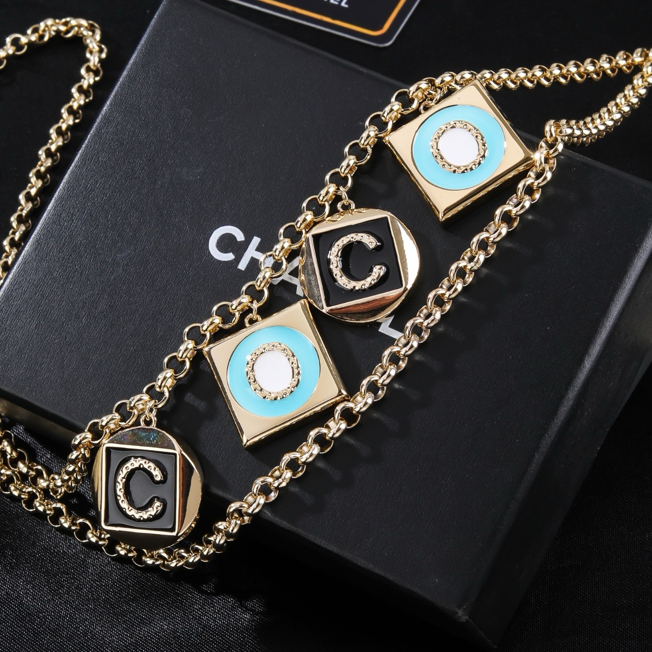 Chanel Coco Charms Double Chain necklace Light gold tone metal black enamel turquoise blue enamel white enamel clear crystal accents 80cm with 10cm extension
