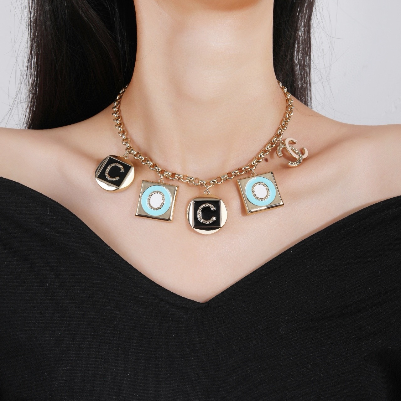 Chanel CC Logo COCO Charm Pendant Chain necklace Gold-tone metal with black enamel turquoise enamel white enamel and crystal accents 40cm with 5cm extender