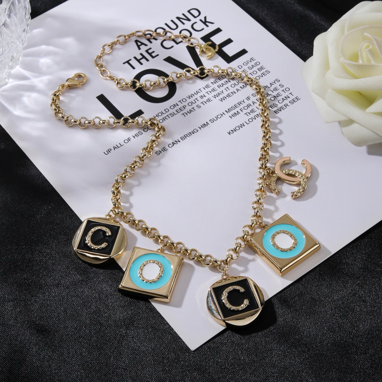 Chanel CC Logo COCO Charm Pendant Chain necklace Gold-tone metal with black enamel turquoise enamel white enamel and crystal accents 40cm with 5cm extender