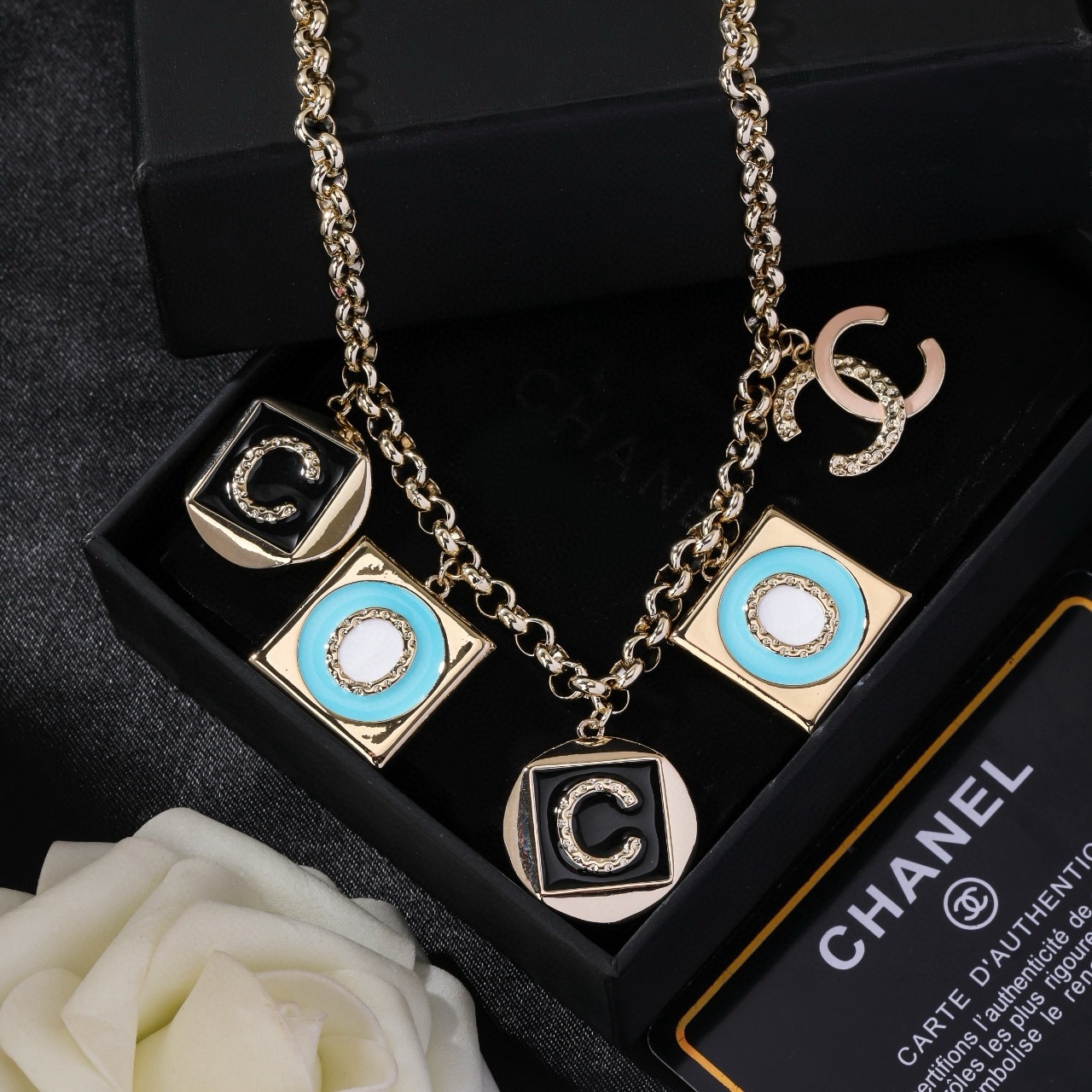 Chanel CC Logo COCO Charm Pendant Chain necklace Gold-tone metal with black enamel turquoise enamel white enamel and crystal accents 40cm with 5cm extender