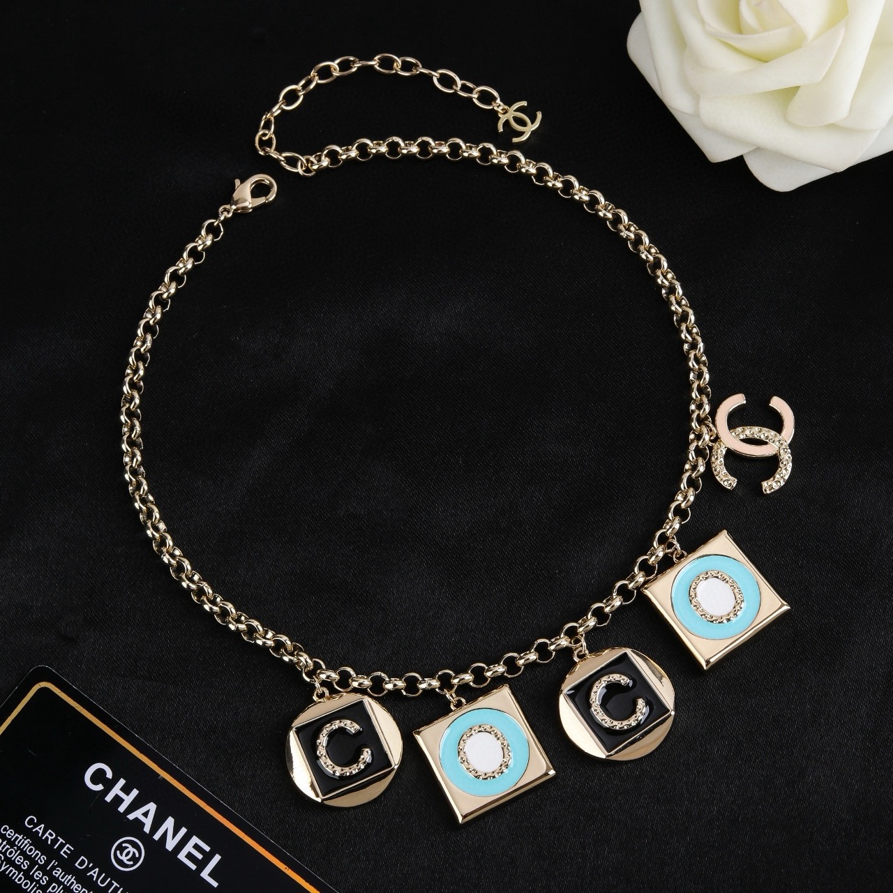 Chanel CC Logo COCO Charm Pendant Chain necklace Gold-tone metal with black enamel turquoise enamel white enamel and crystal accents 40cm with 5cm extender