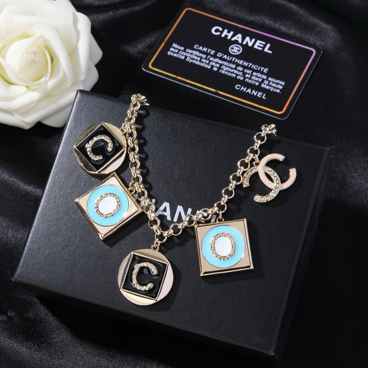 Chanel CC Logo COCO Charm Pendant Chain necklace Gold-tone metal with black enamel turquoise enamel white enamel and crystal accents 40cm with 5cm extender