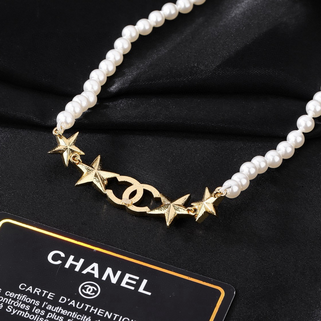Chanel CC Star Pearl Choker necklace Gold-tone metal white faux pearls clear crystals opalescent pink accent stones 38cm with 5cm extender