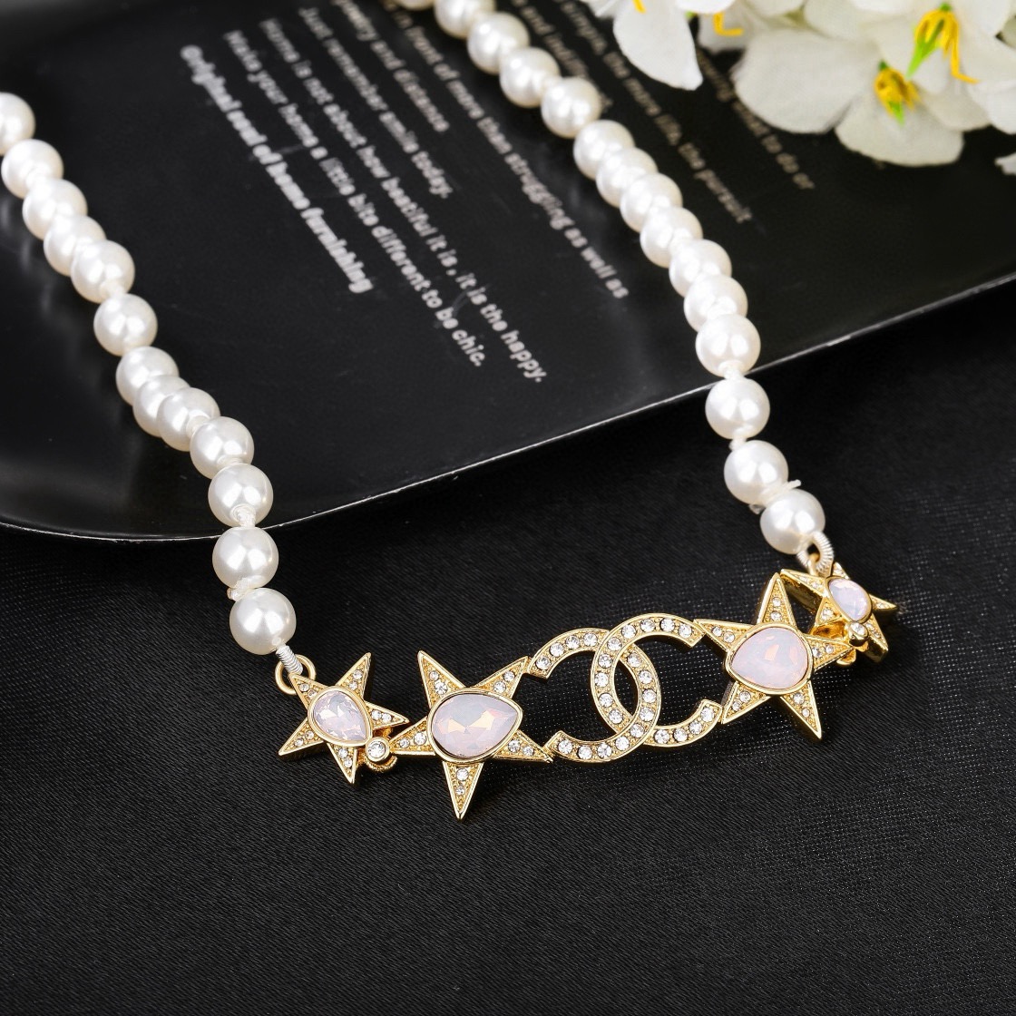 Chanel CC Star Pearl Choker necklace Gold-tone metal white faux pearls clear crystals opalescent pink accent stones 38cm with 5cm extender