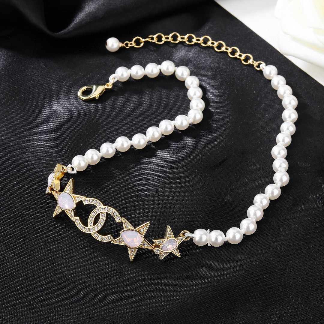 Chanel CC Star Pearl Choker necklace Gold-tone metal white faux pearls clear crystals opalescent pink accent stones 38cm with 5cm extender