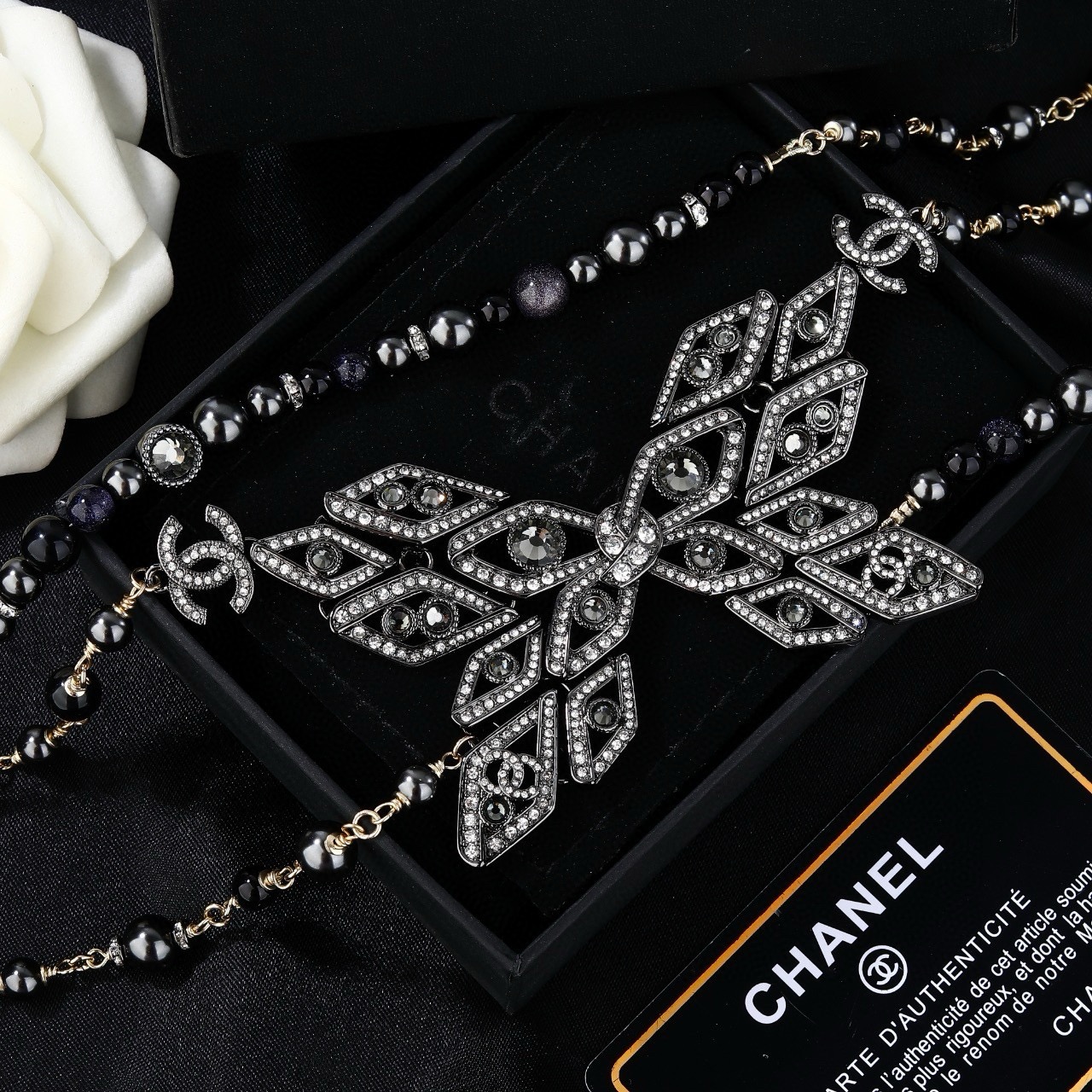 Chanel CC Snowflake Multi-Strand Beaded Chain necklace Gold-tone and gunmetal-tone metal with black beads and clear crystal accents 80cm